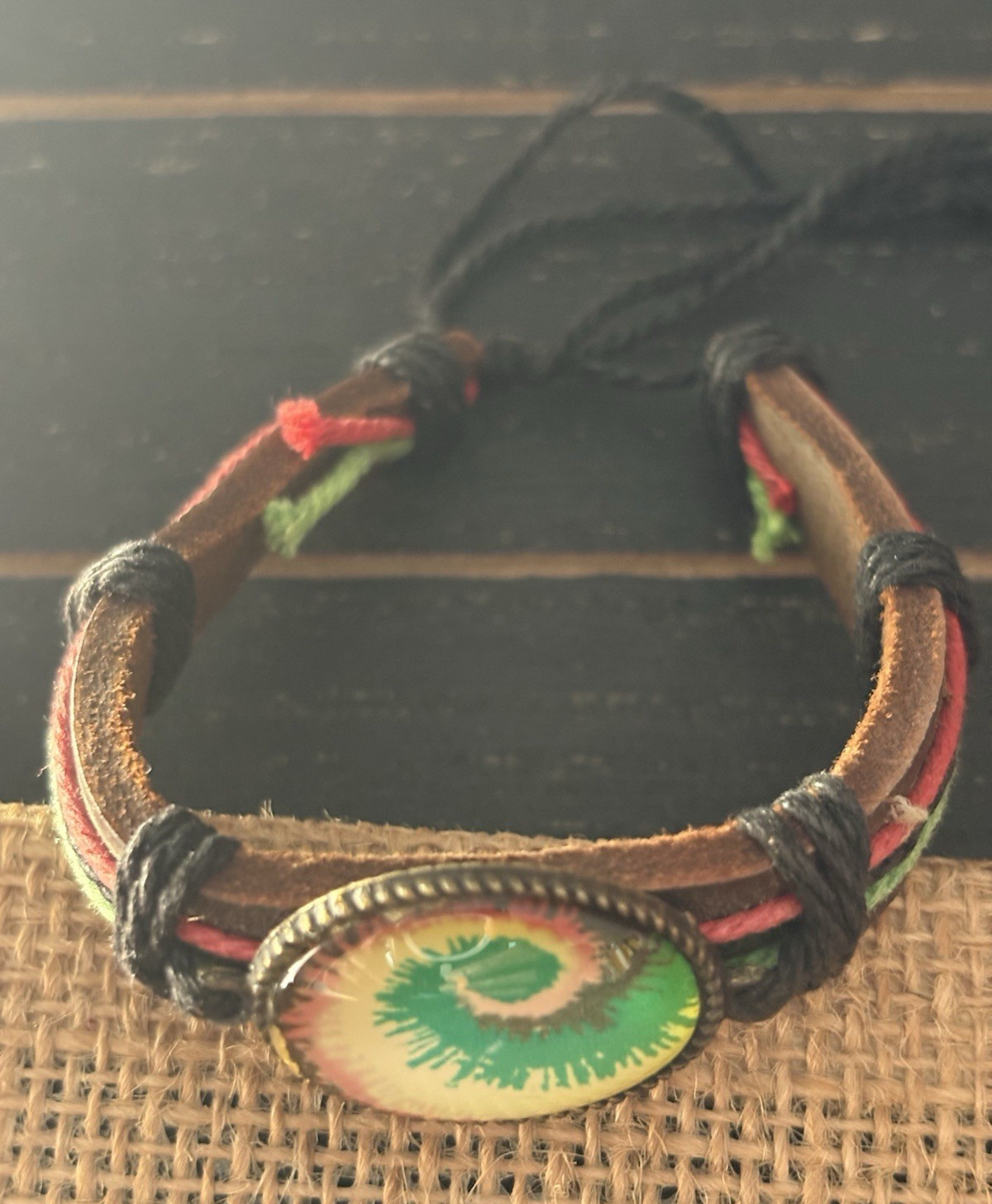 adjustable leather cuff bracelet . oval eye design . brown black red green