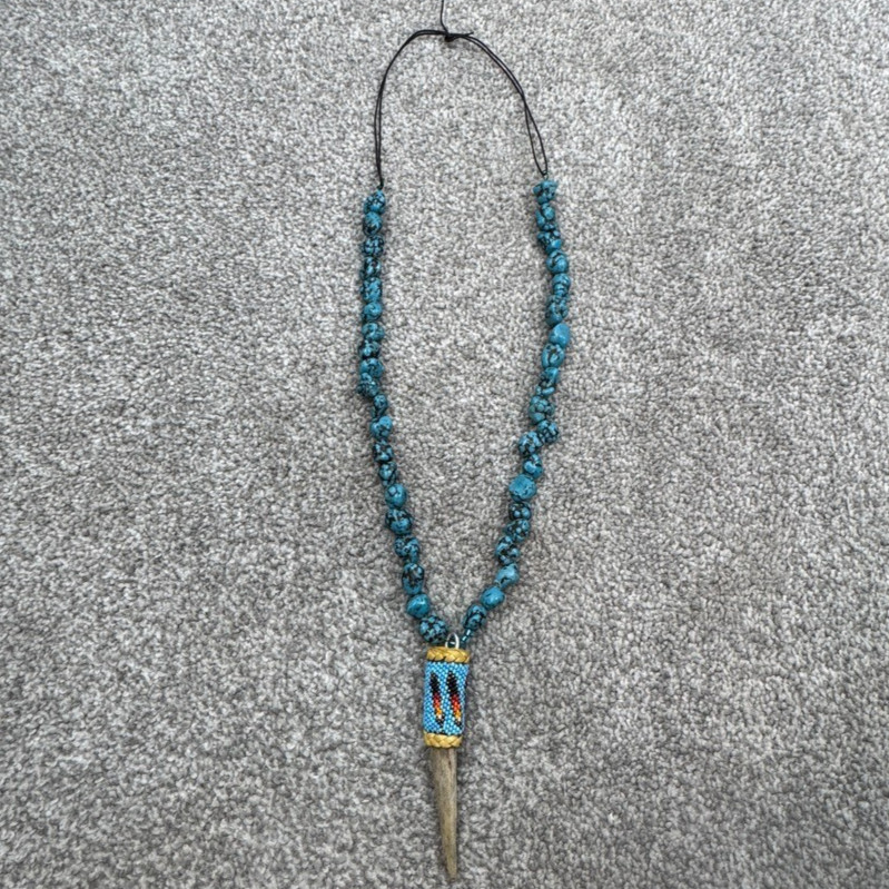 Handmade Necklace With Bone Pendant Wrapped In Beading On Blue Speckled Stones