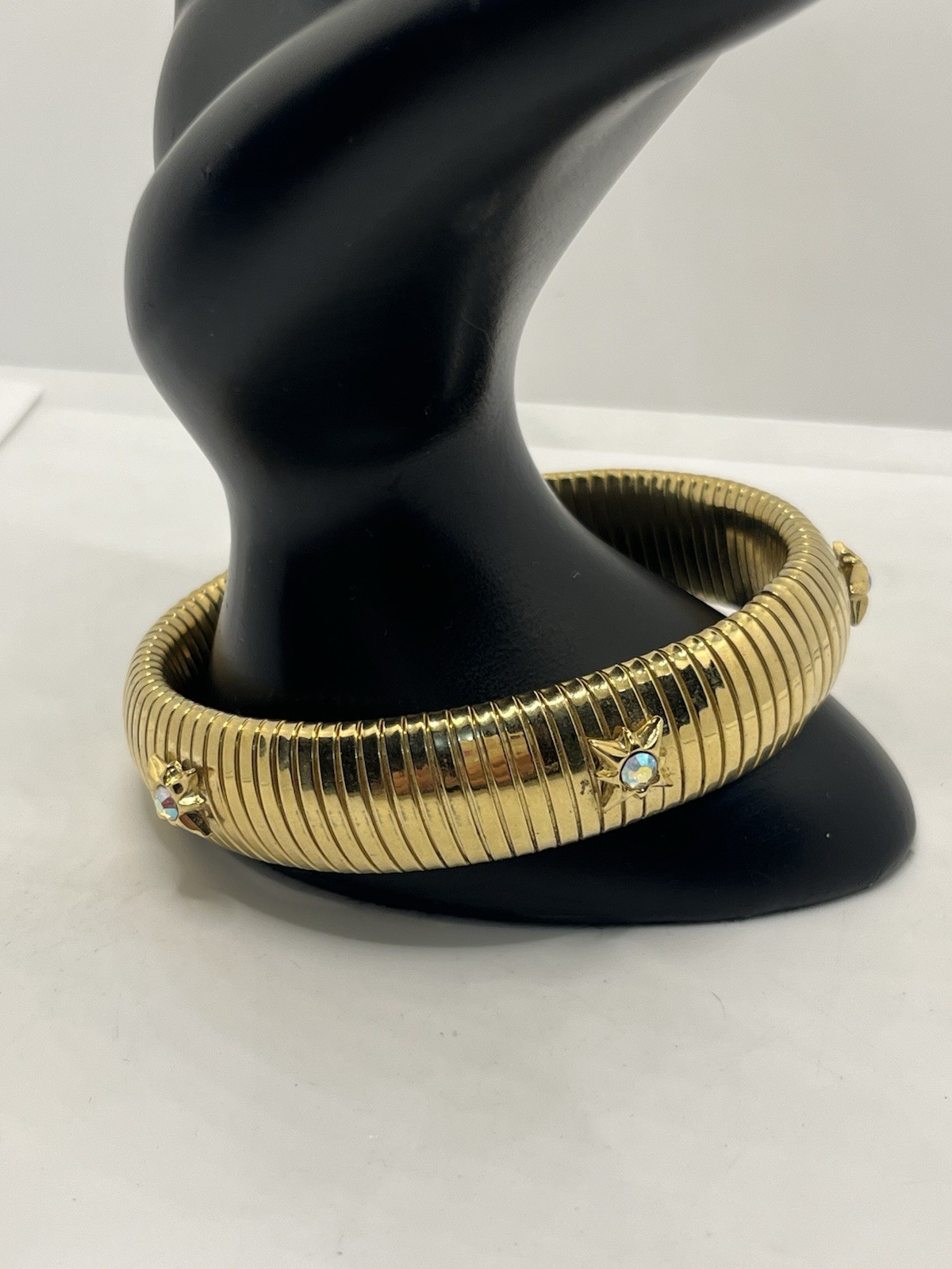 Kirks Folly gold tone tubogas stretch bracelet rhinestone aurora borealis stars