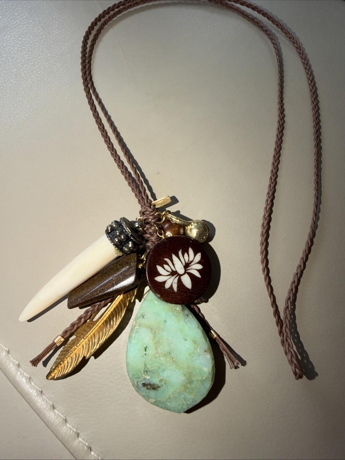 “Chan Luu Braided Cord Charm Necklace Lotus Wood Horn Tooth Feather Gemstone”