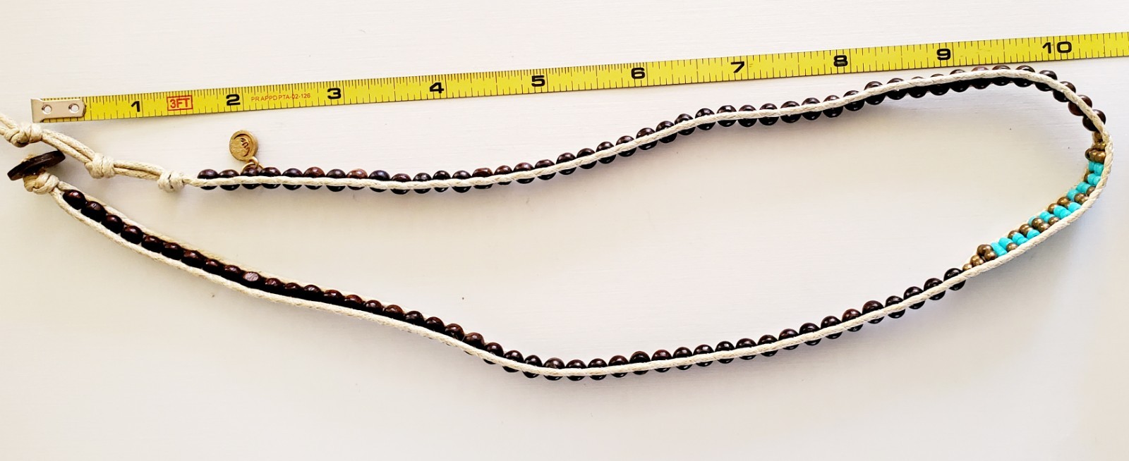 Lotus & Luna 21 inch string & bead necklace. Brown with turquoise accent beads.
