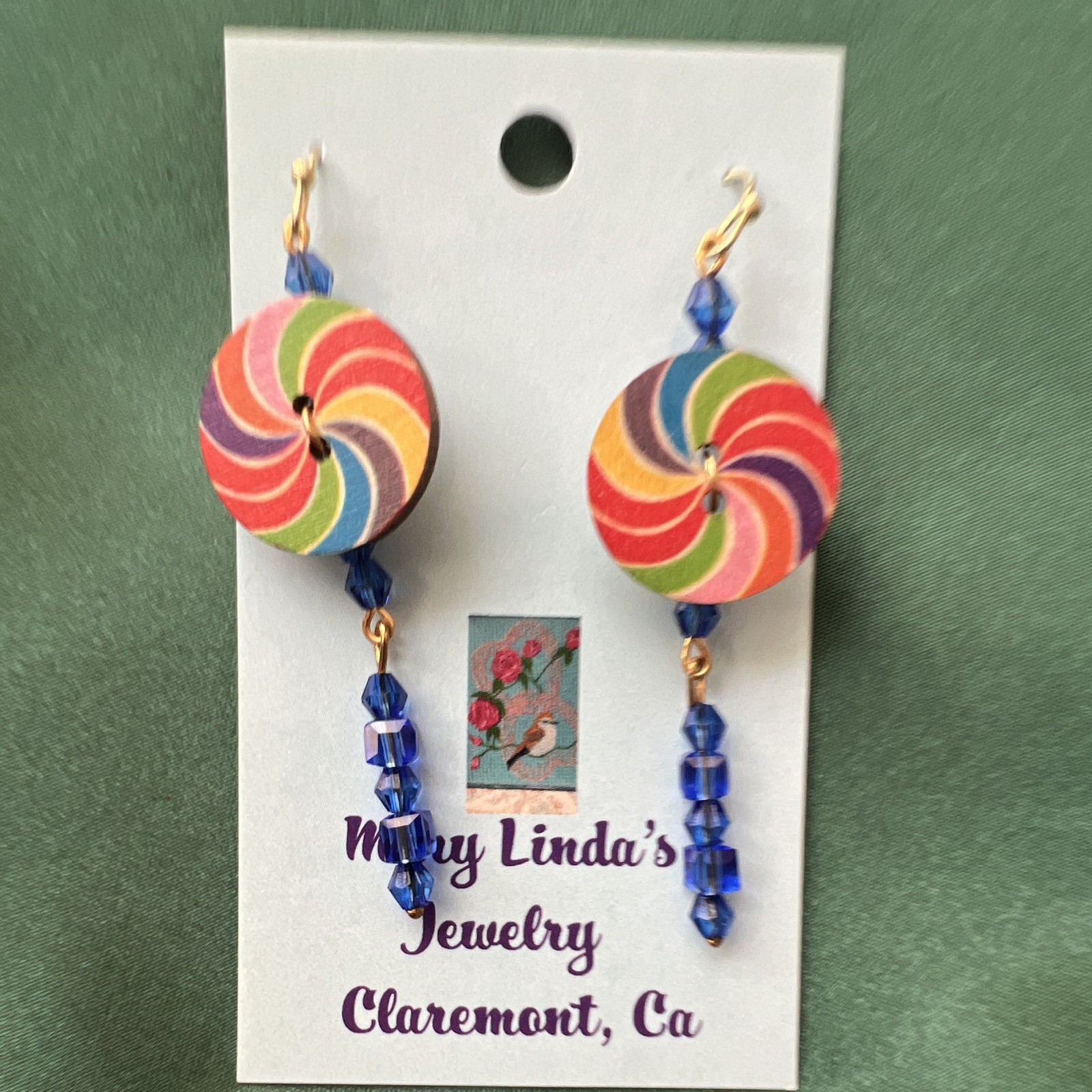 Earrings, wooden candy, lollipop, golden ear, wires, blue crystals.