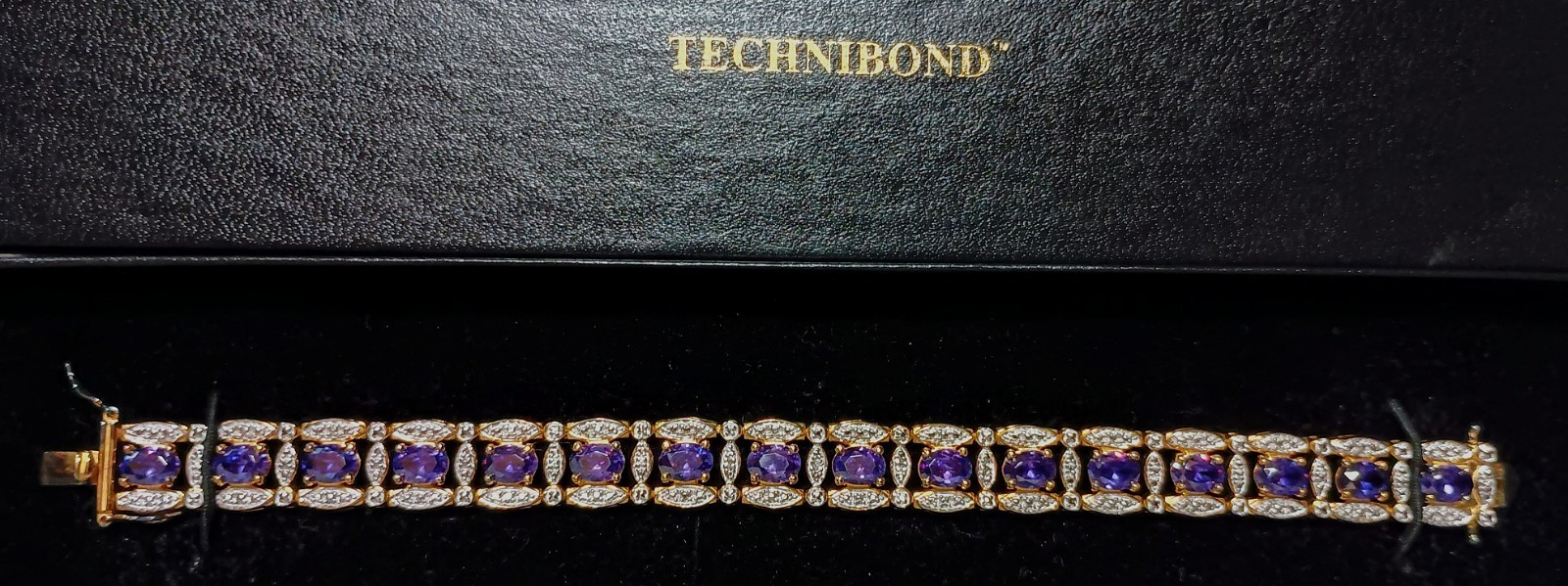 TECHNIBOND PURPLE GEMSTONES ACCENTED WITH CLEAR CRYSTALS TENNIS BRACELET 7″