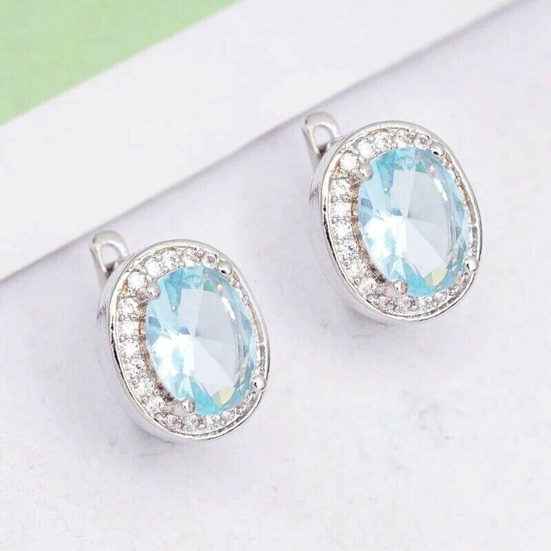 ZARD Halo Earrings in Oval Cut Aquamarine and CZ with English Lock Closures