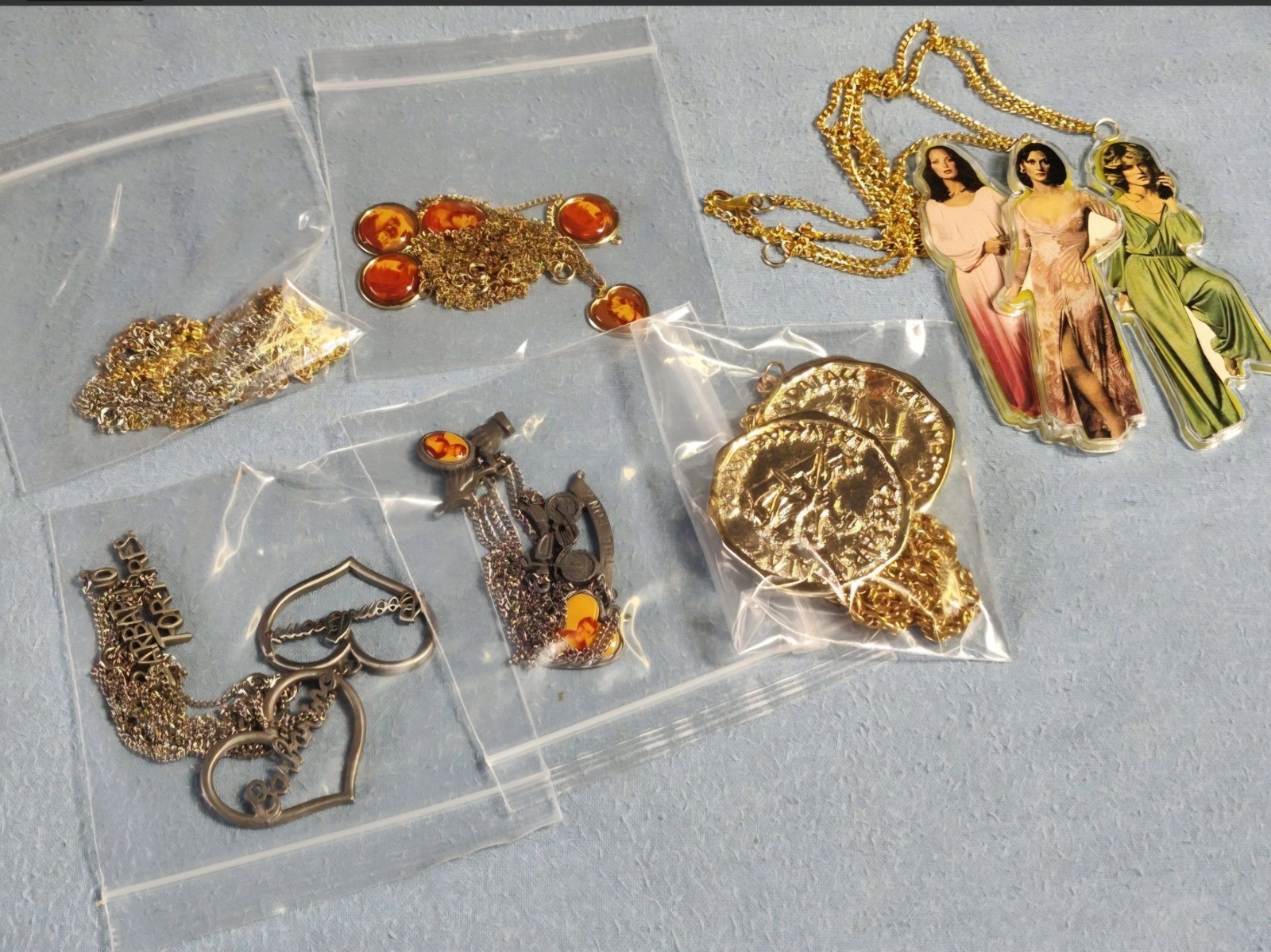 1970s Children’s necklaces – Charlie’s Angels, Hardy Boys, Happy Days and more