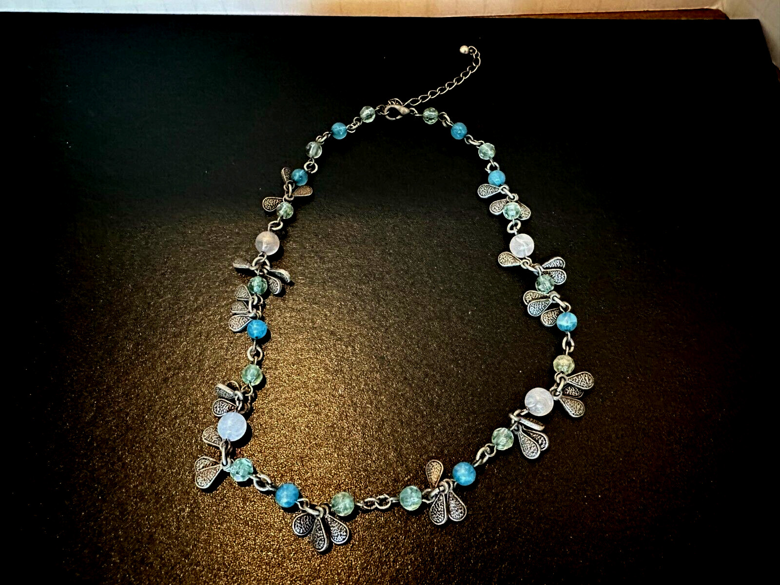 Fashion jewelry necklace 16″ bead and metal accents as shown.