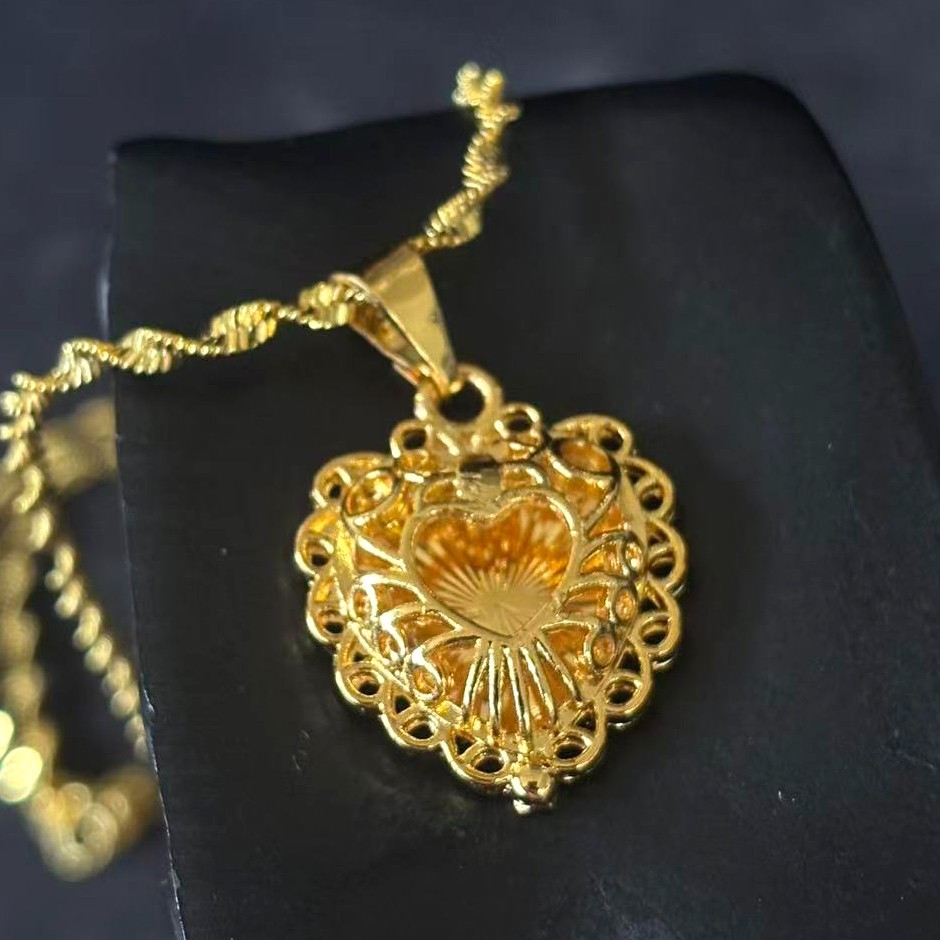 Hollowed-out Heart Gold-plated (NOT SURE) Pendant Necklace marked ‘999’, 17 in