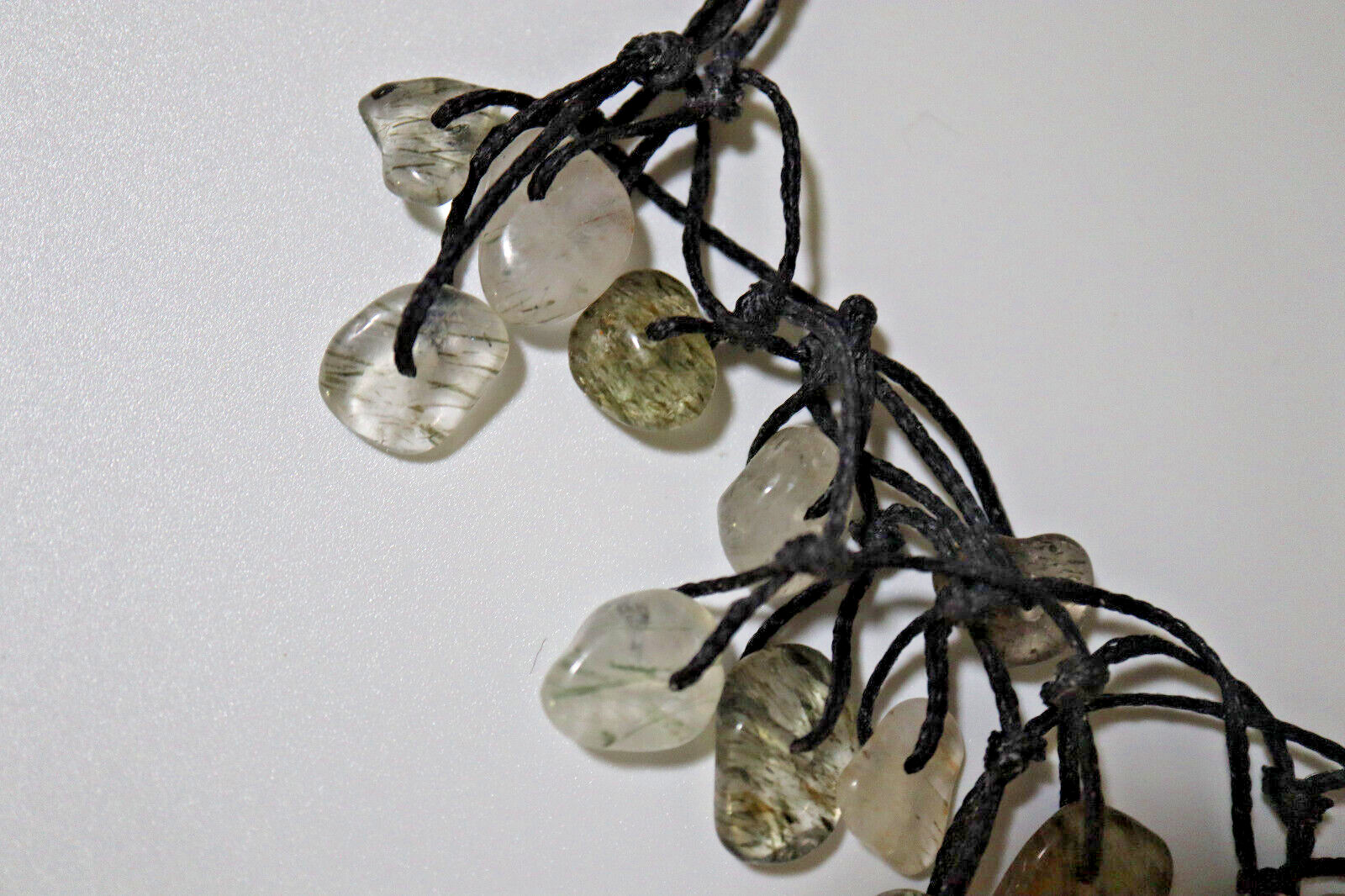 NECKLACE BLACK BRAIDED CORD W/OVER 40 POLISHED RUTILATED QUARTZ STONES 14″-26″