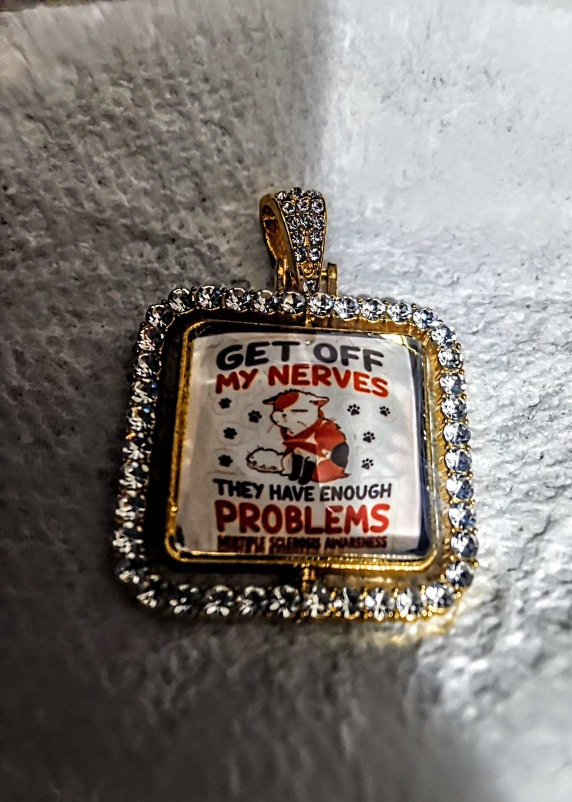 Square White Crystal Pavé Border Charm Pendant, Awareness, “GET OFF MY NERVES”