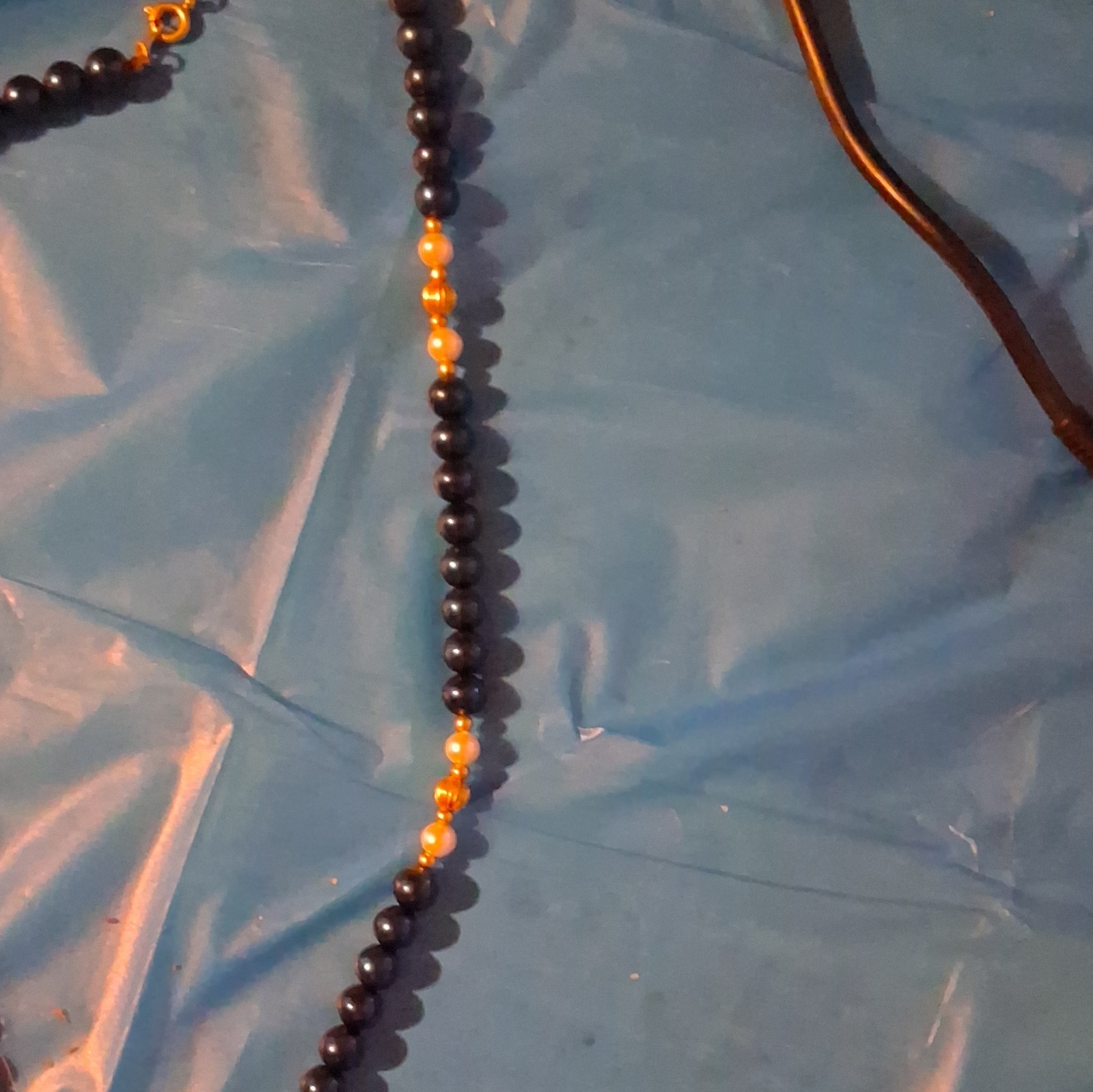Black Beaded Necklace with Gold Tone Bead Accents, Spring Ring Clasp