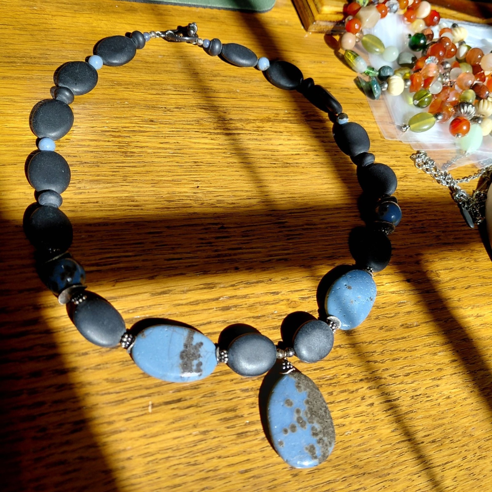 Gorgeous stone necklace matte black sky blue brown spots