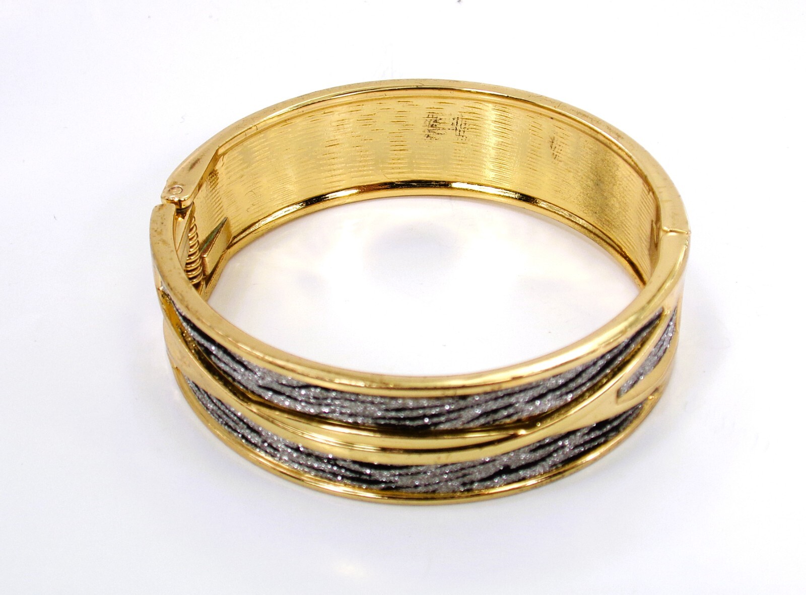 Gold bangle wide bracelet with a silver and black sparkle, spring opening New