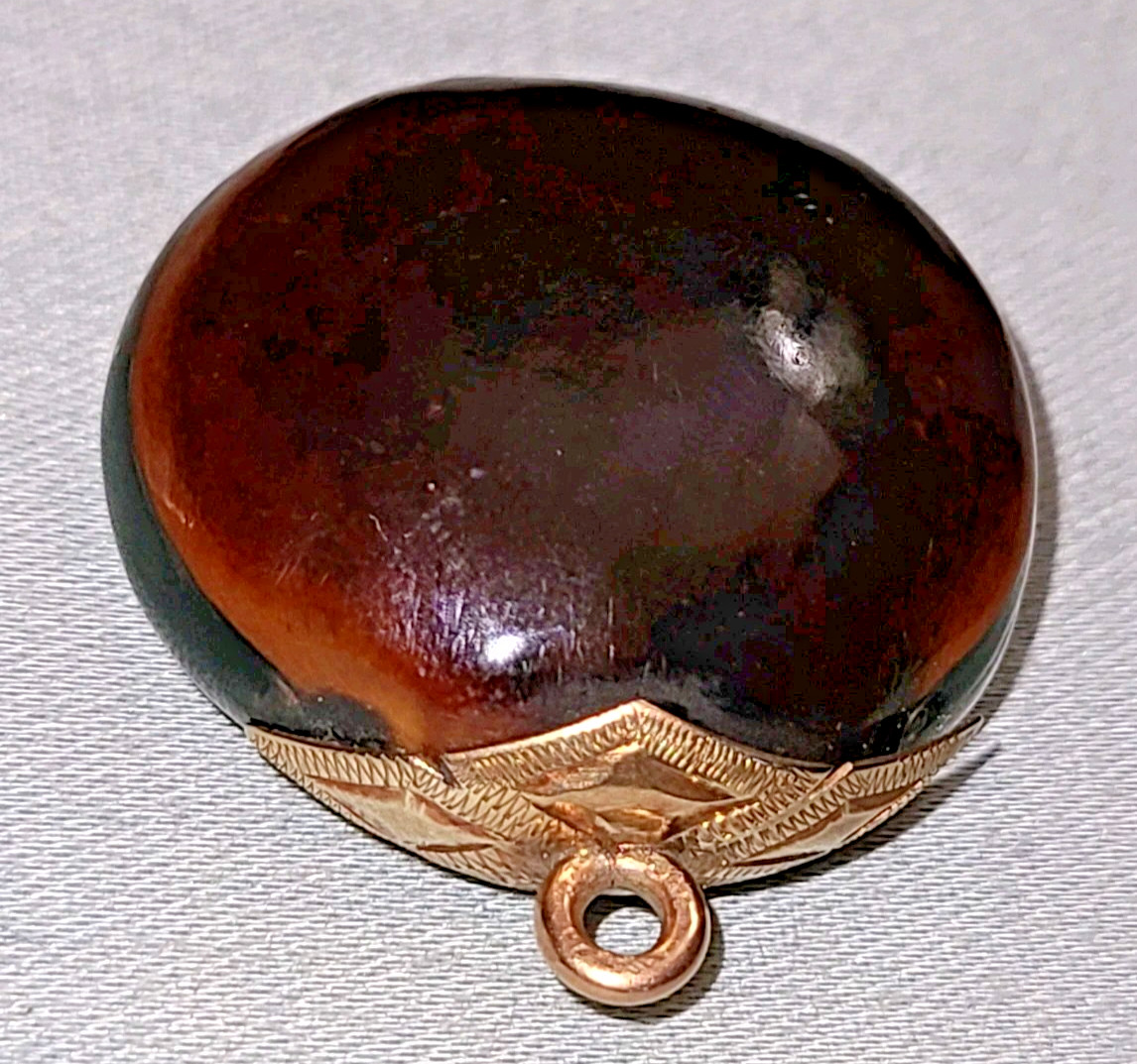 Antique Victorian polished mucuna / sea bean pendant, gold tone bail