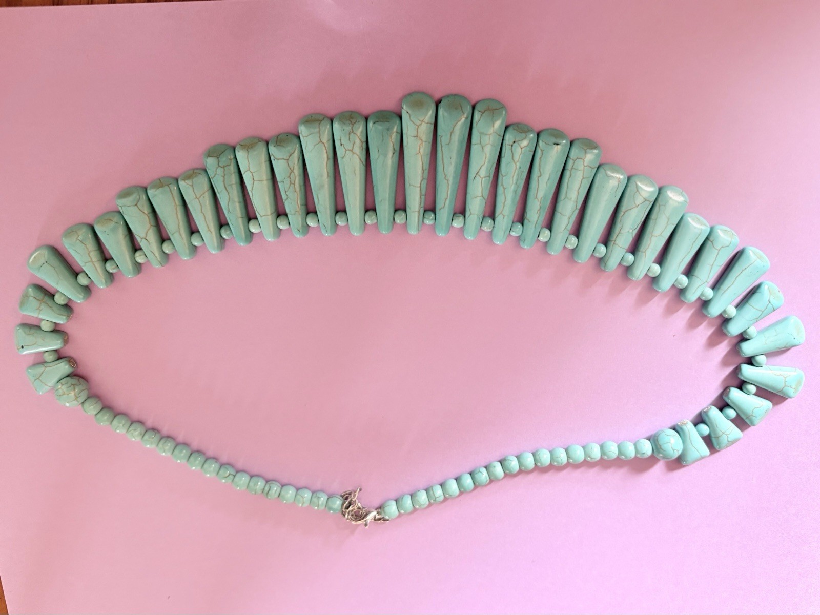 A Graduated Turquoise Colored Spike Bib Statement Neck Necklace