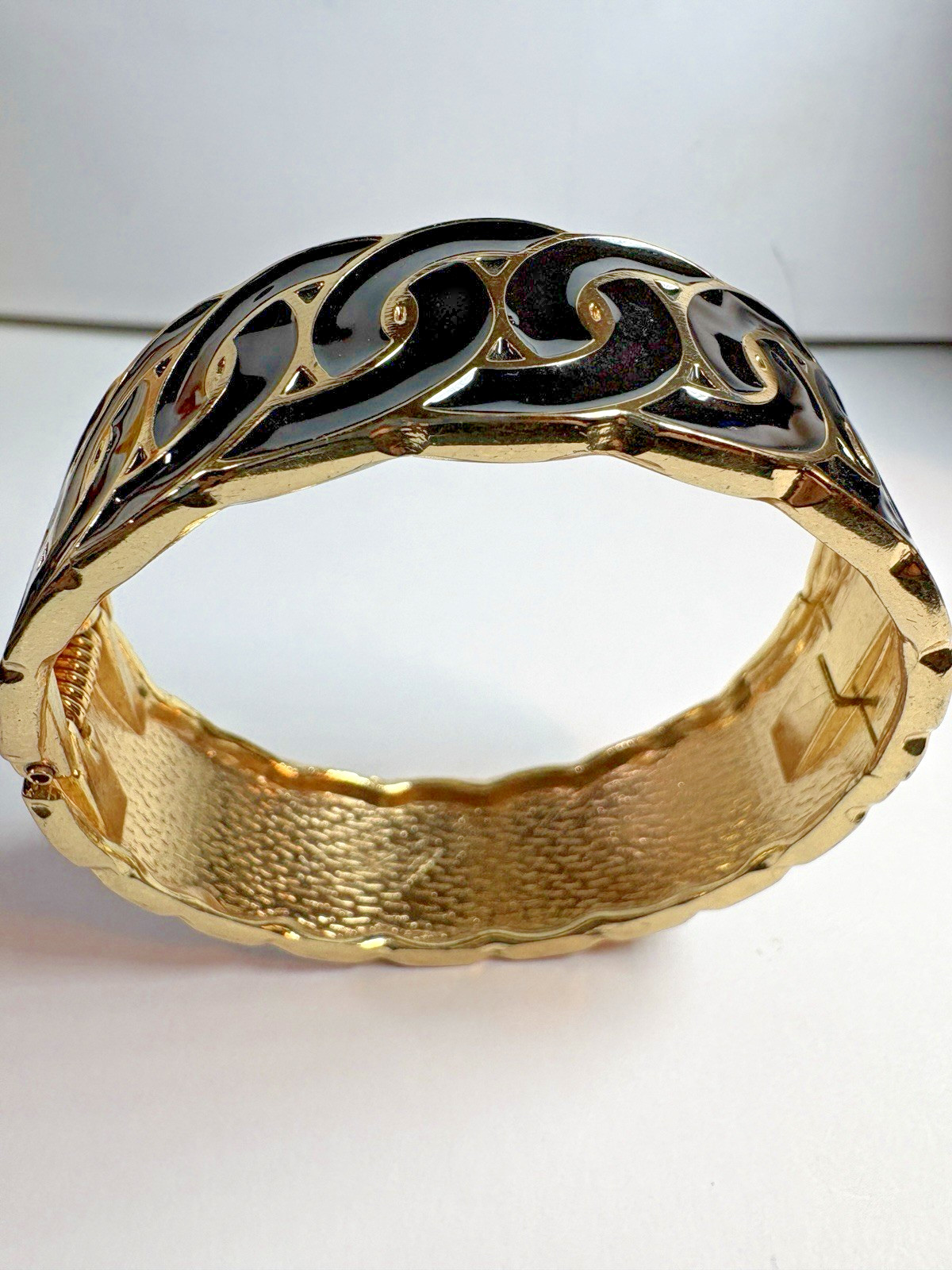 Bold and modern hinged cuff bracelet ,gold-tone with black enamel