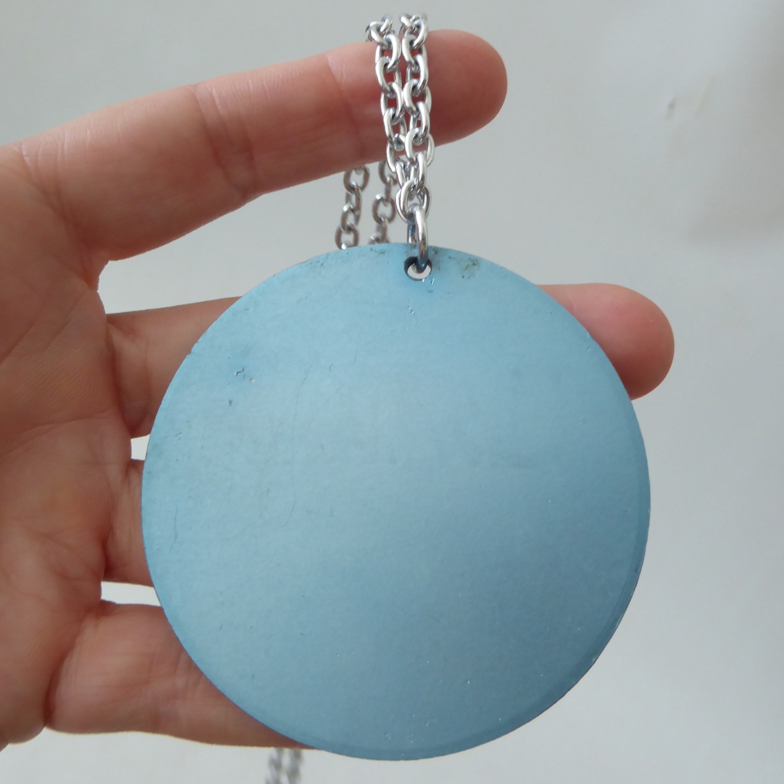 Conrah cristillium pendant necklace. Aluminium anodised blue metal. Geometric