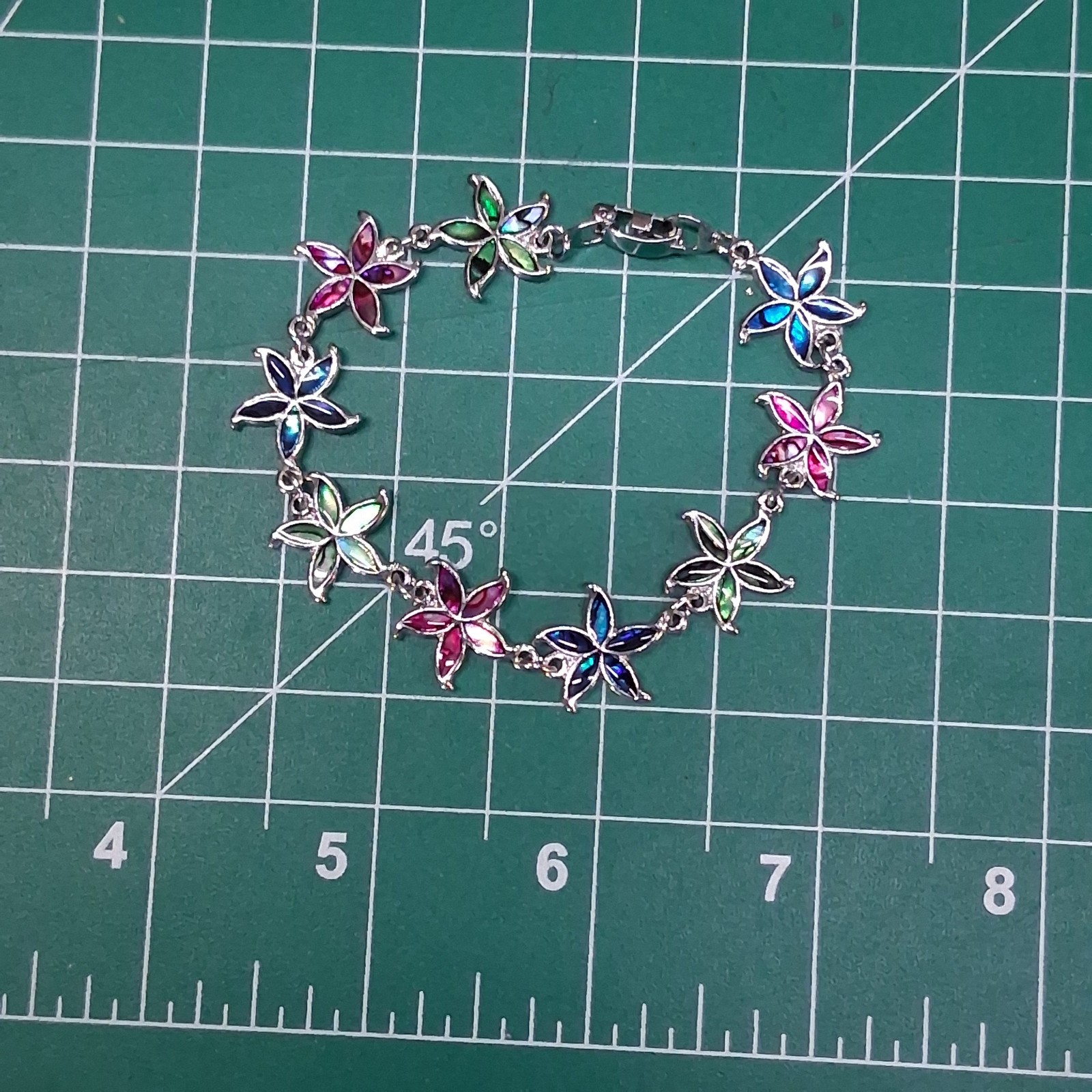 Shimmering Multicolor Linked Starfish Design Fold Over Clasp Chain Bracelet