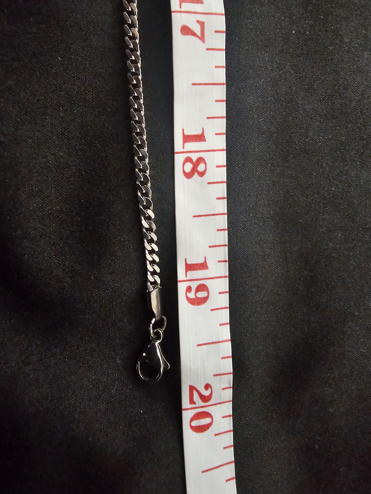 20in. 2.4mm stainless stl chain w/ a Silver plated Cross Pendant 11 prong set CZ