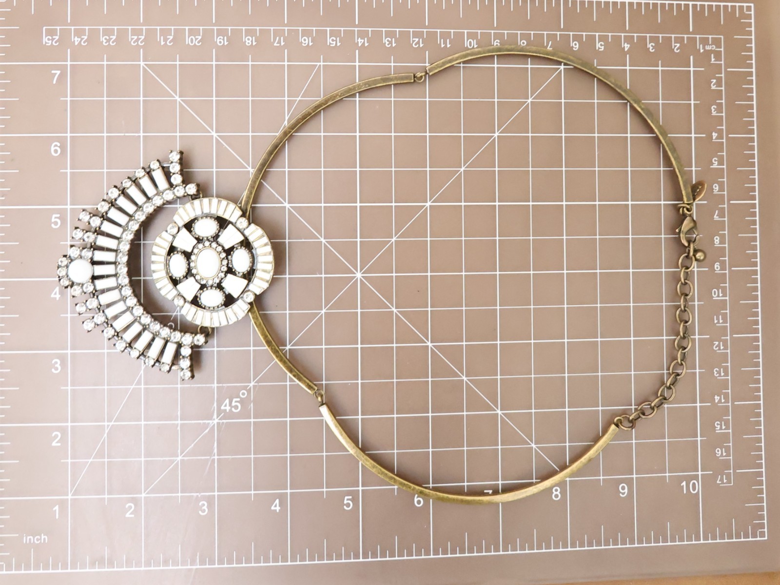 Logo Links necklace Lori Goldstein ivory crystals statement collar bronzetone
