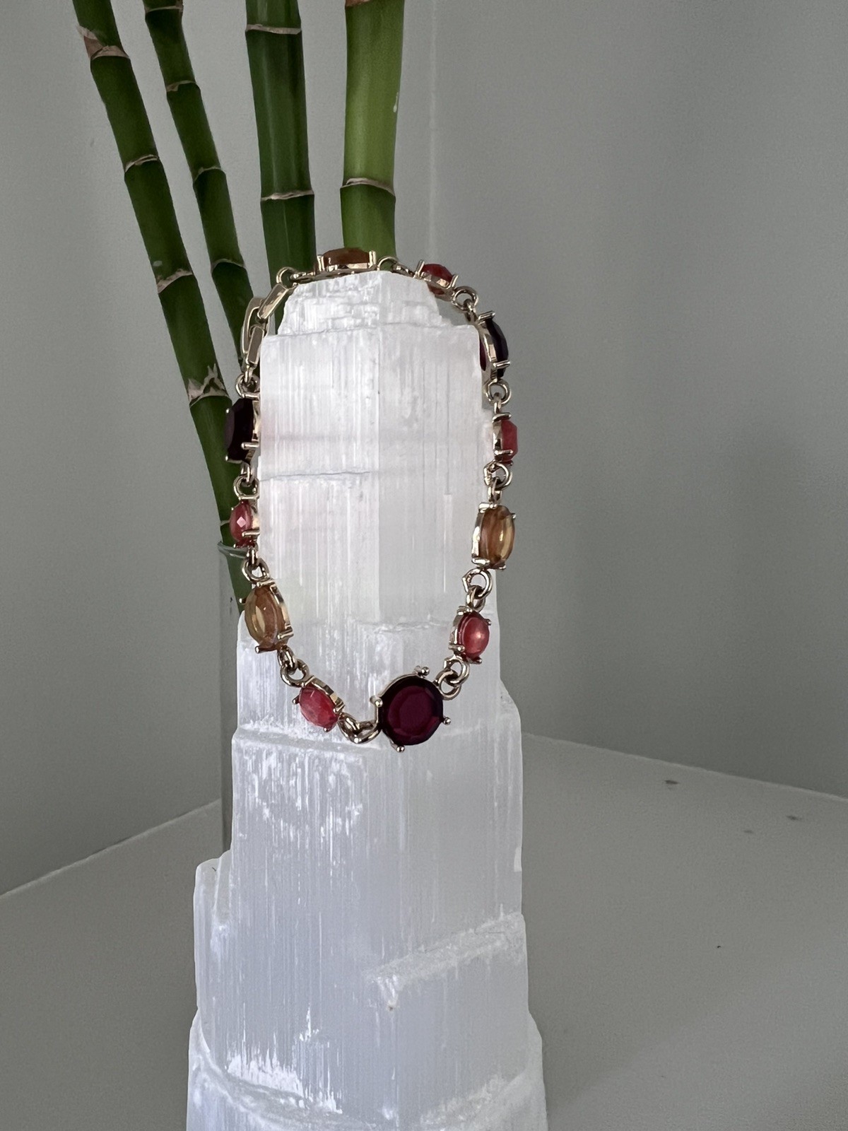 UPBEAT earth tones rhinestone bracelet 7 in length/ fold over clasp/ gold tone