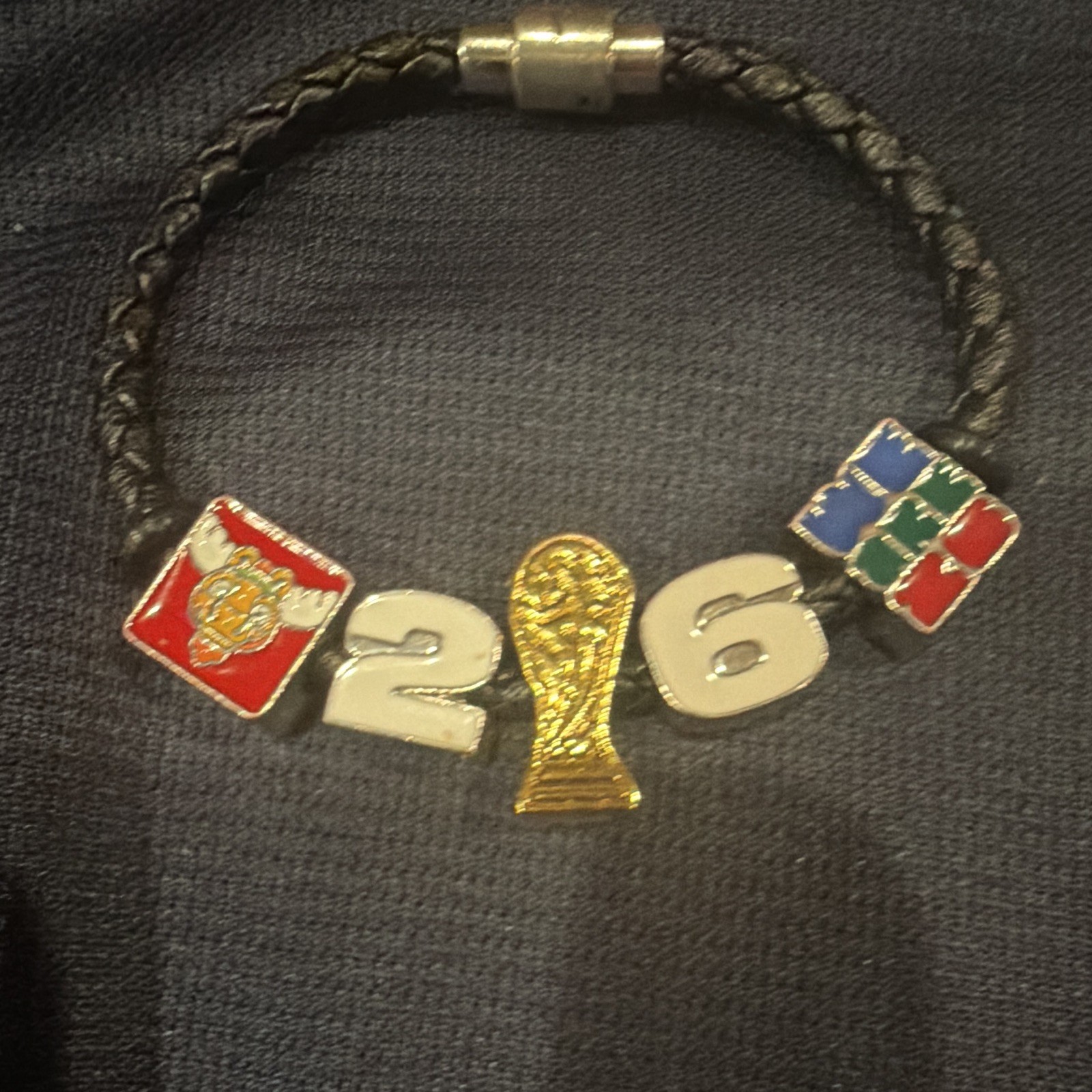 FIFA Fan Festival bracelet black with Canadian moose and a mystery Panini card.