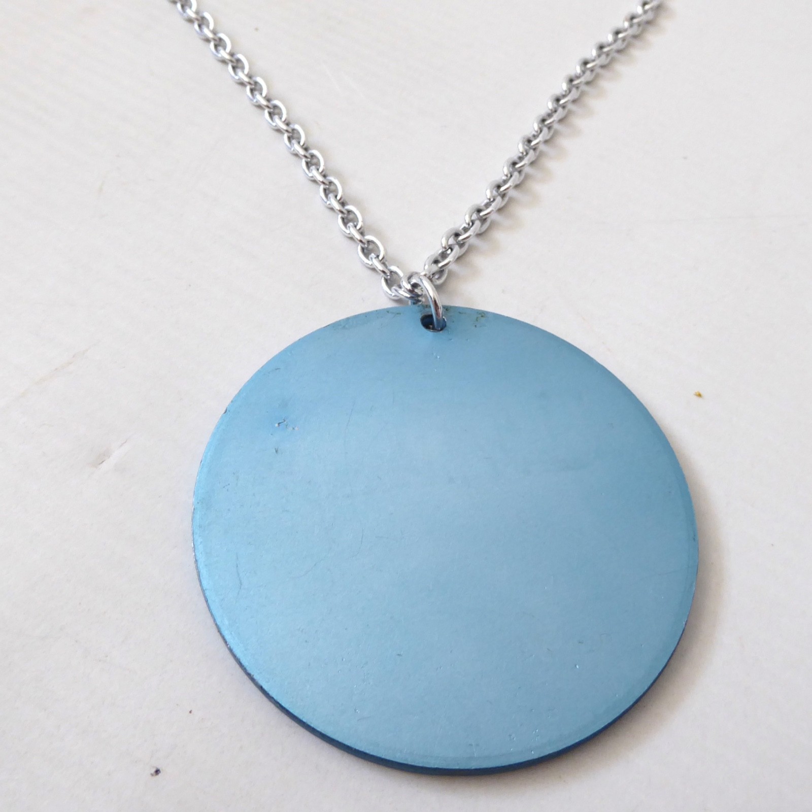 Conrah cristillium pendant necklace. Aluminium anodised blue metal. Geometric