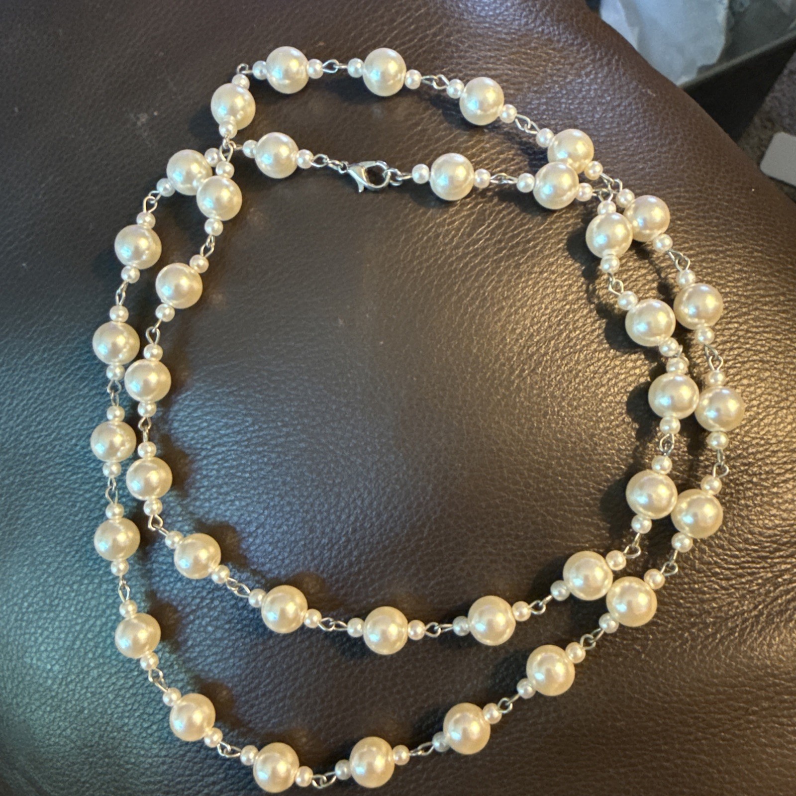 Faux White Pearl Bead Necklace – 32” in length-Silver Toned. 52
