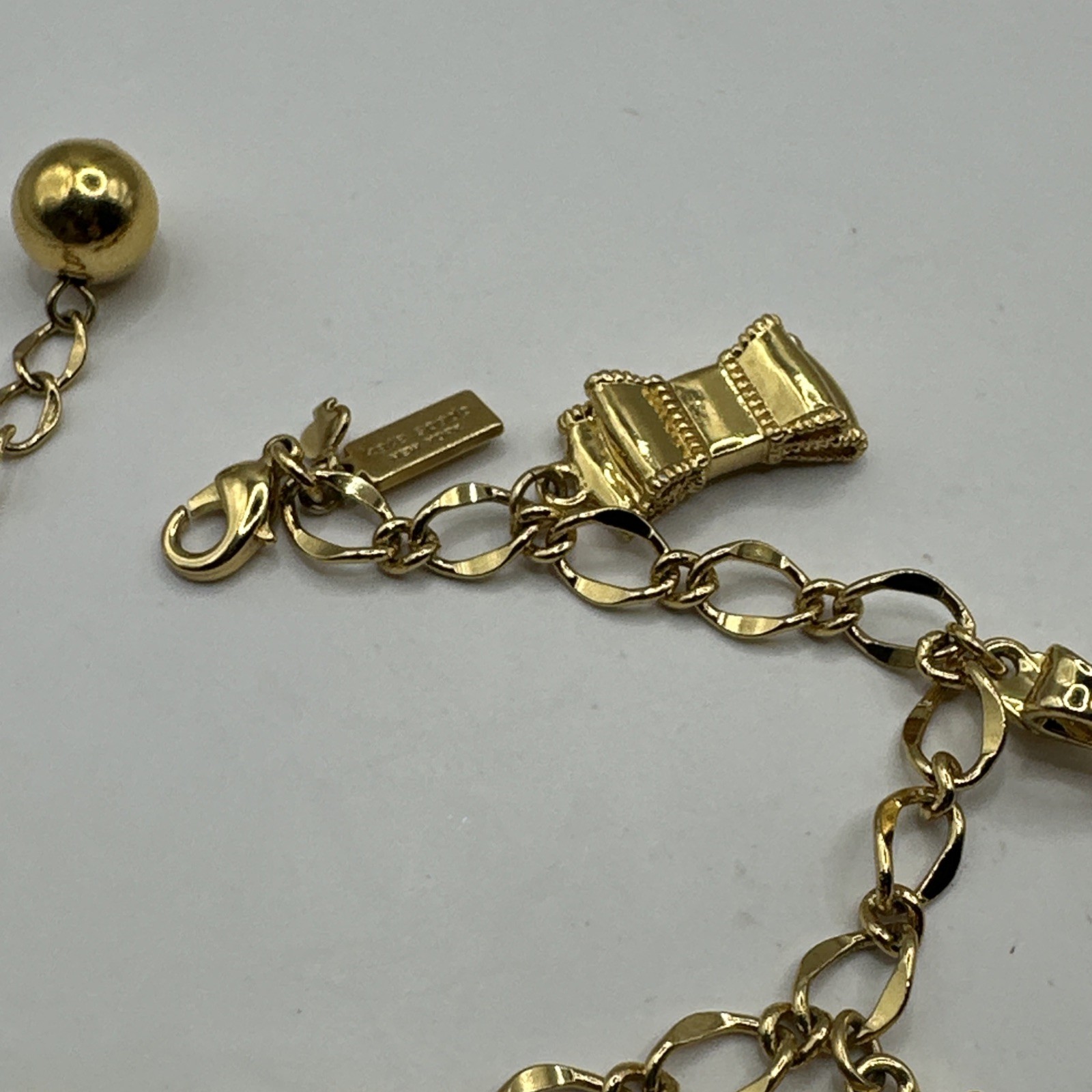 Adorable Kate Spade Charm Bracelet with Bows Gold Tone 7-8.5”