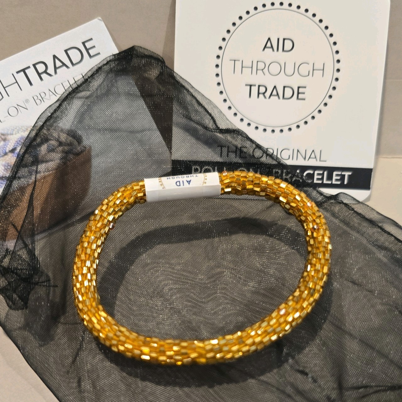 Aid Through Trade Roll-On Beaded Bracelet Gold Nepal Glass Bead Fair Trade NWT