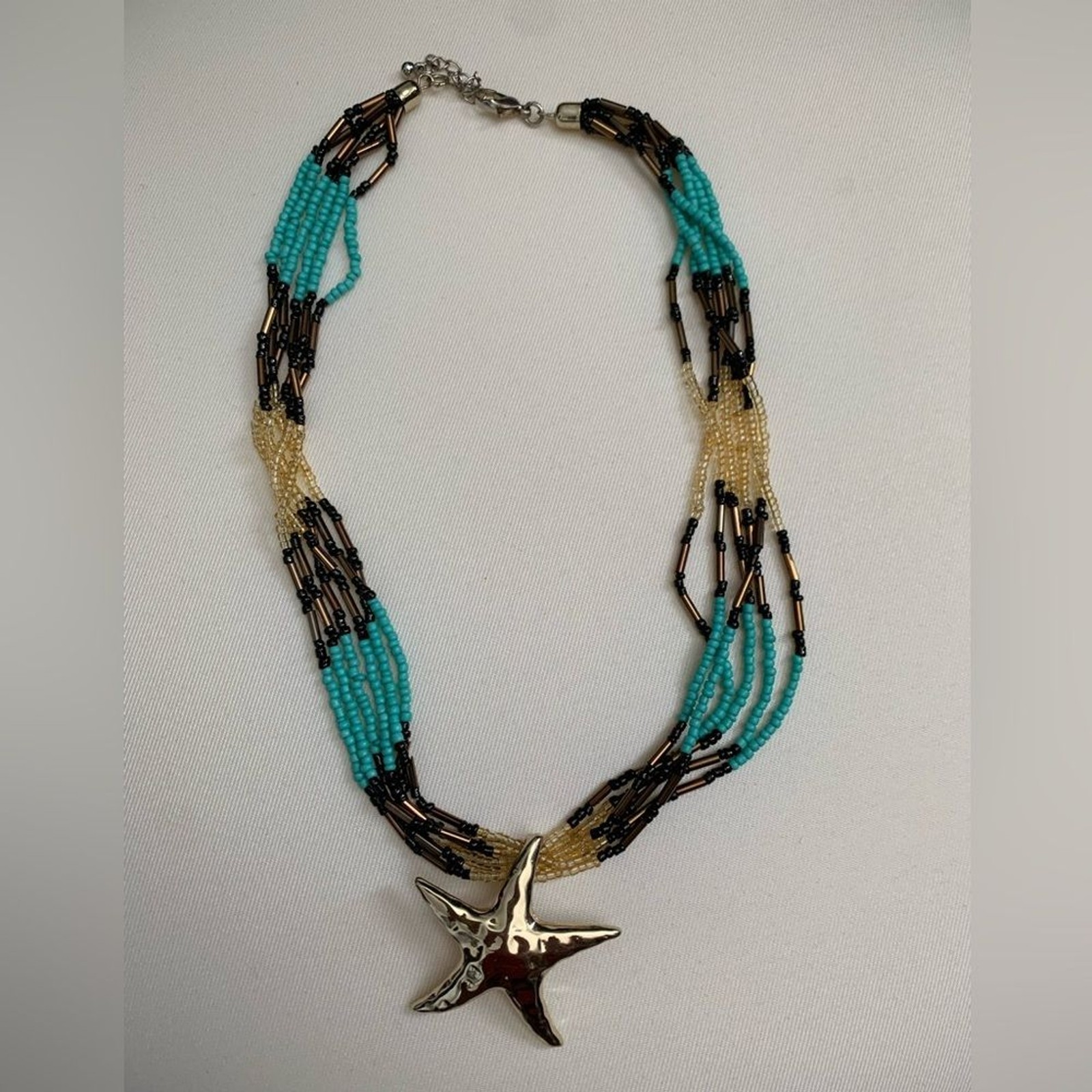 Starfish boho indie beaded summer necklace gold blue black with gold pendant!