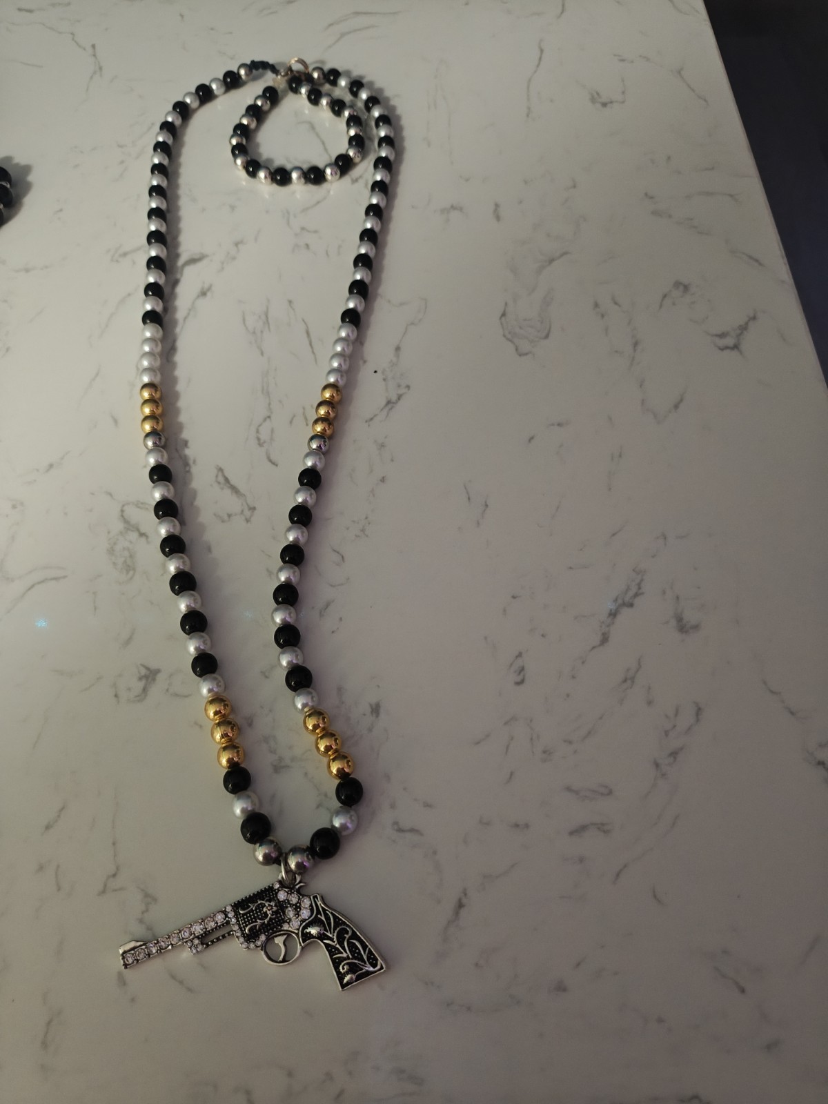 Black/White/Gold Beaded Ball Chain Necklace with Silver-Tone Gun Charm Pendant