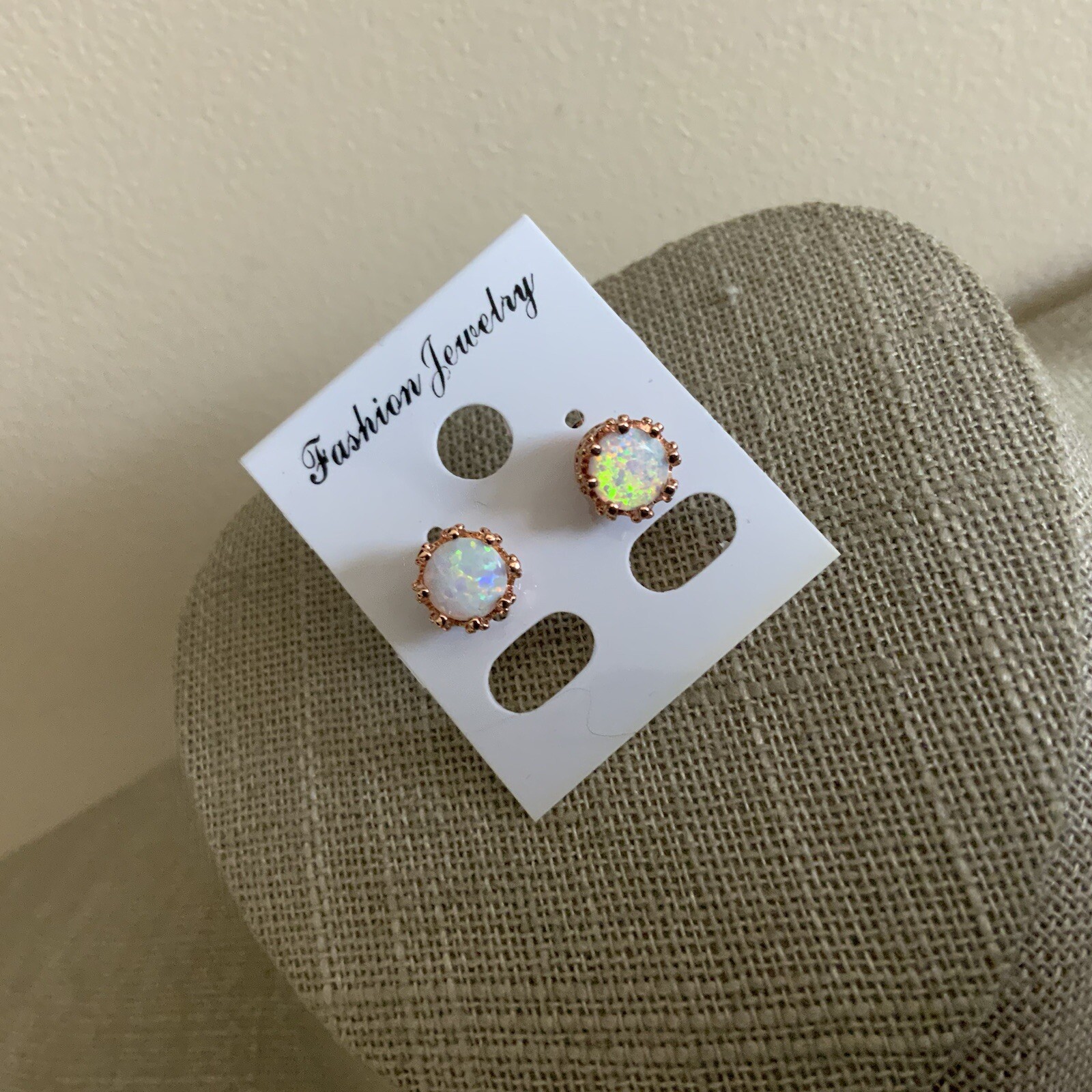 Man made faux opal crown setting rose gold colored stud earrings
