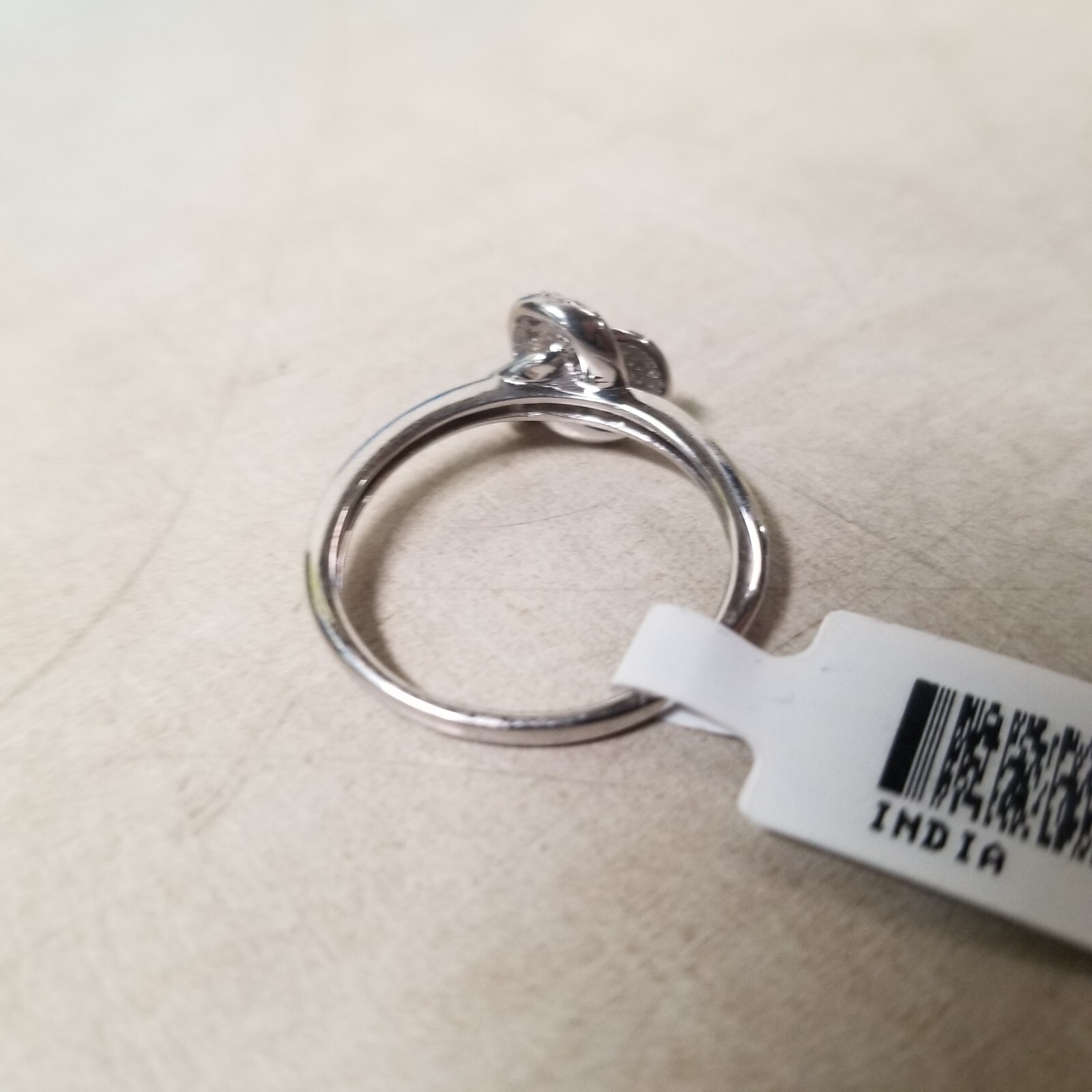 White Diamond Rhodium Over Sterling Silver Knot Ring 0.15ctw