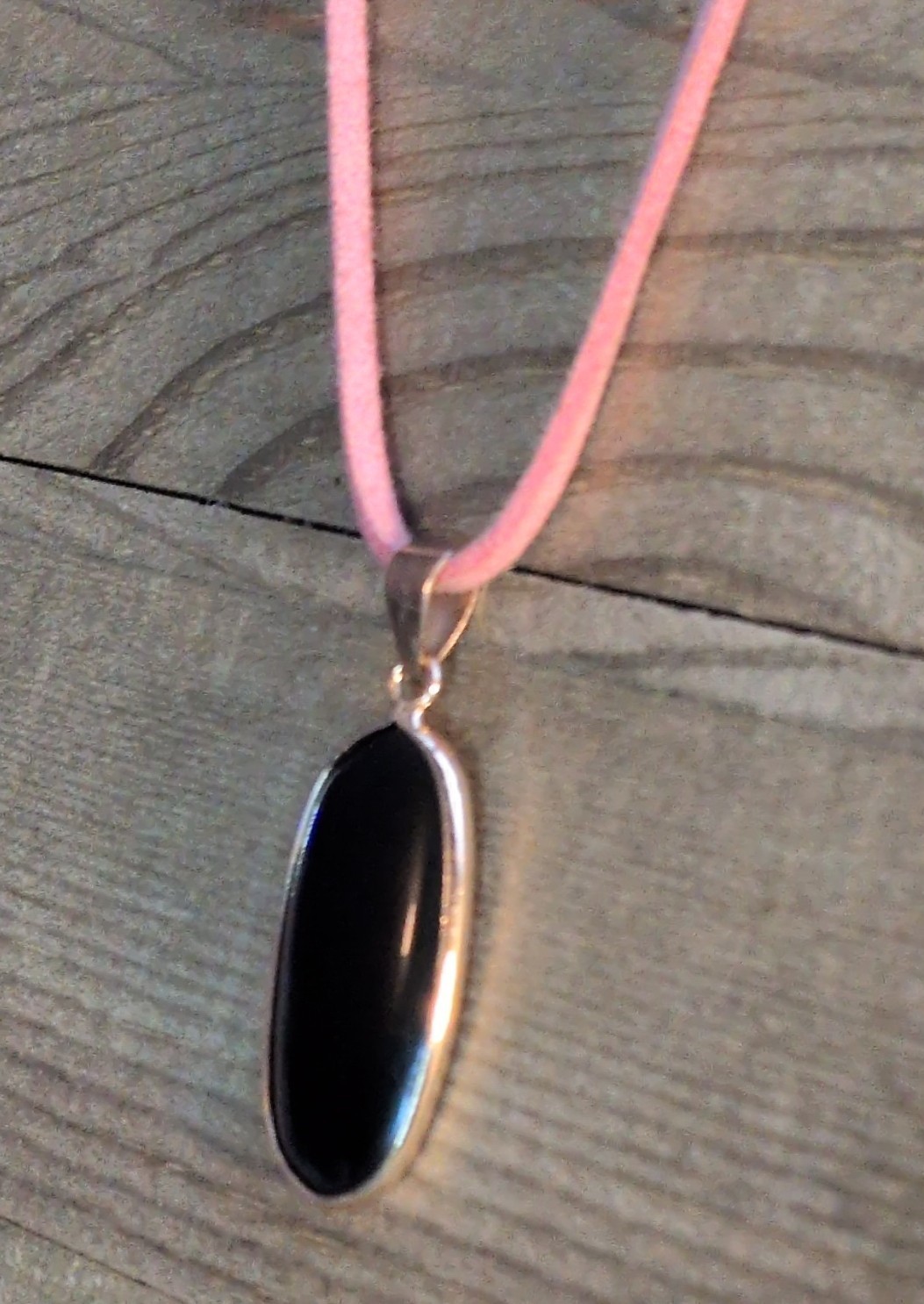 Bezel-Set Oval Black Onyx Charm Pendant Necklace on Pink Cord, Silver Tone