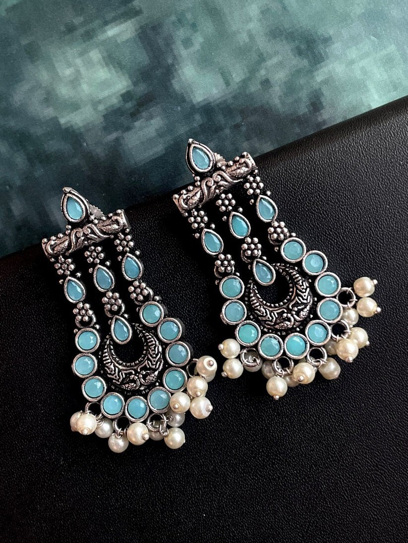 Colourful statement chandelier earrings