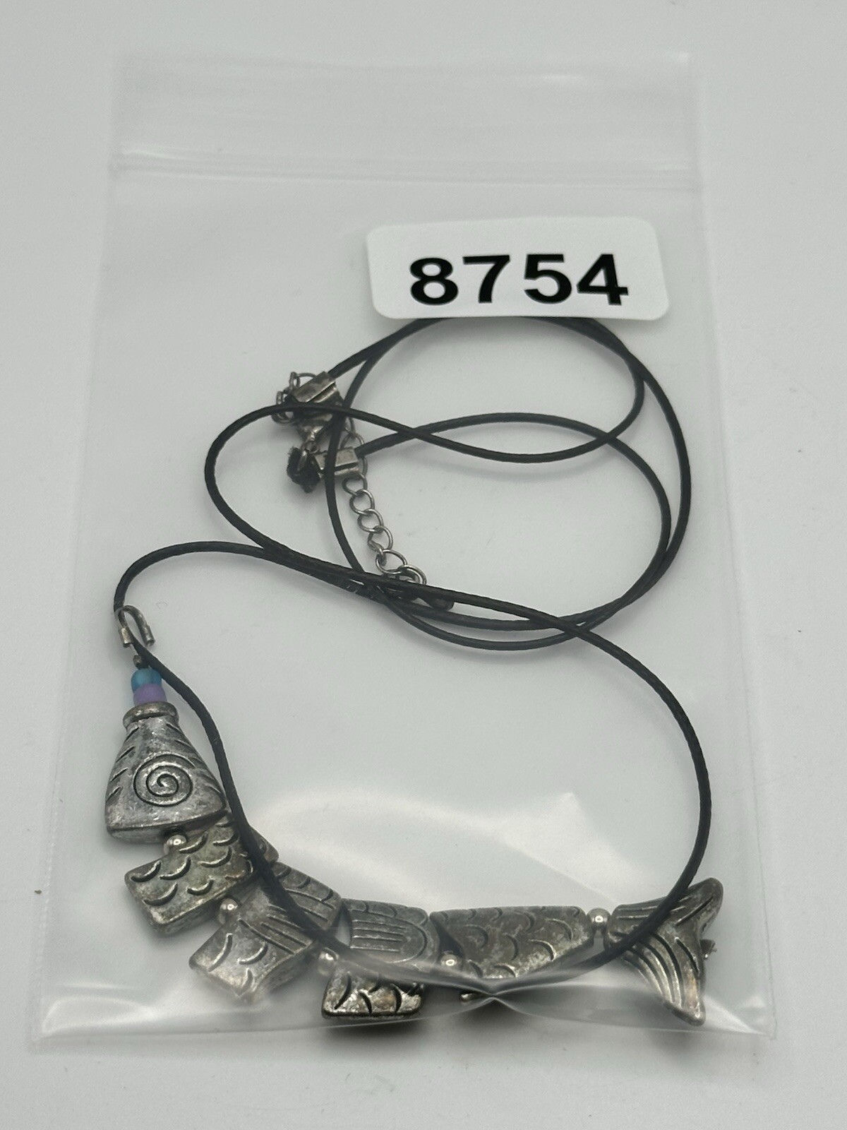 Six Segment Worry Fish Pendant On 24” Nylon Necklace With Lobster Clasp