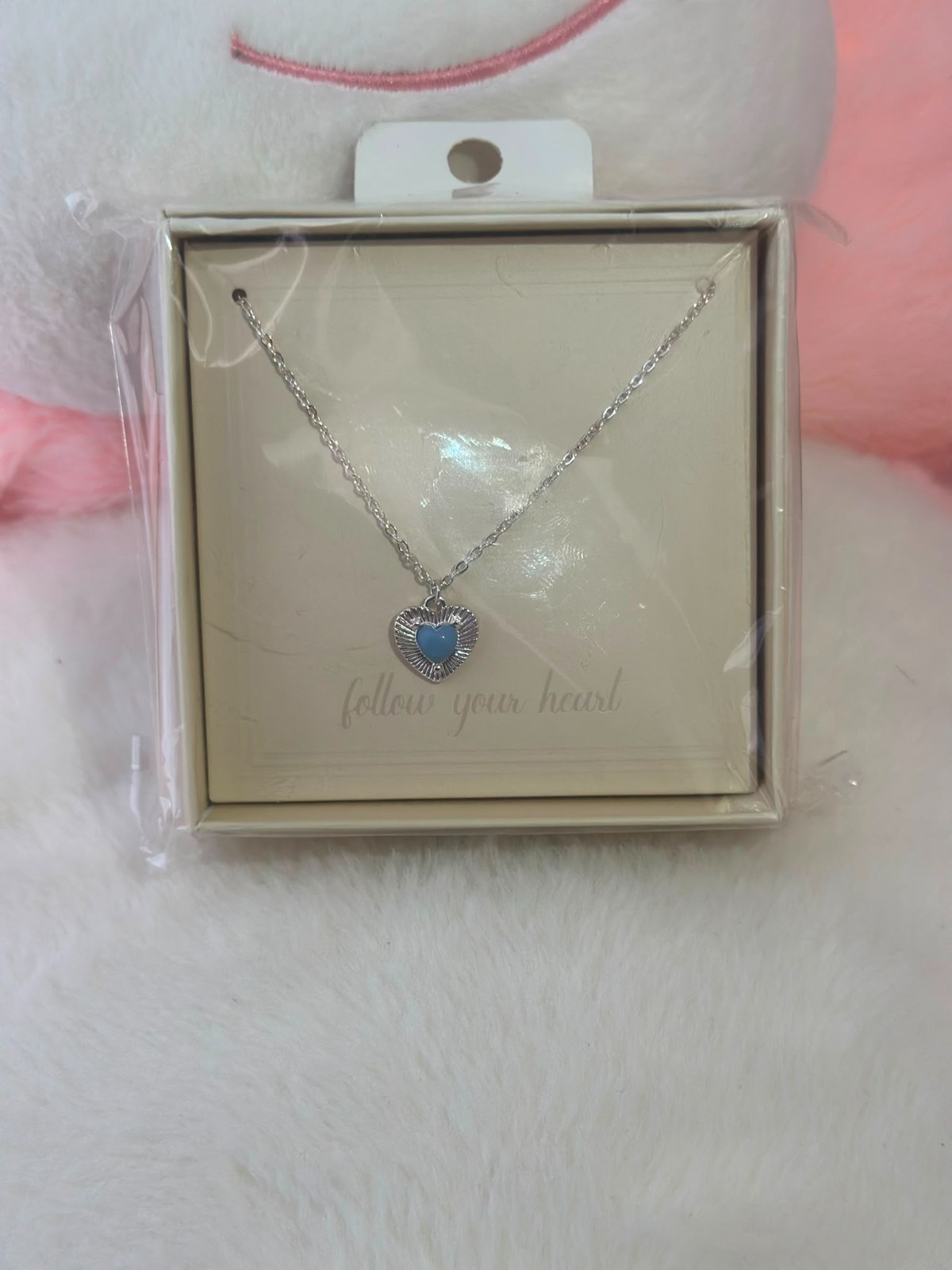A smooth, rust-resistant silver chain featuring an elegant and attractive blue h