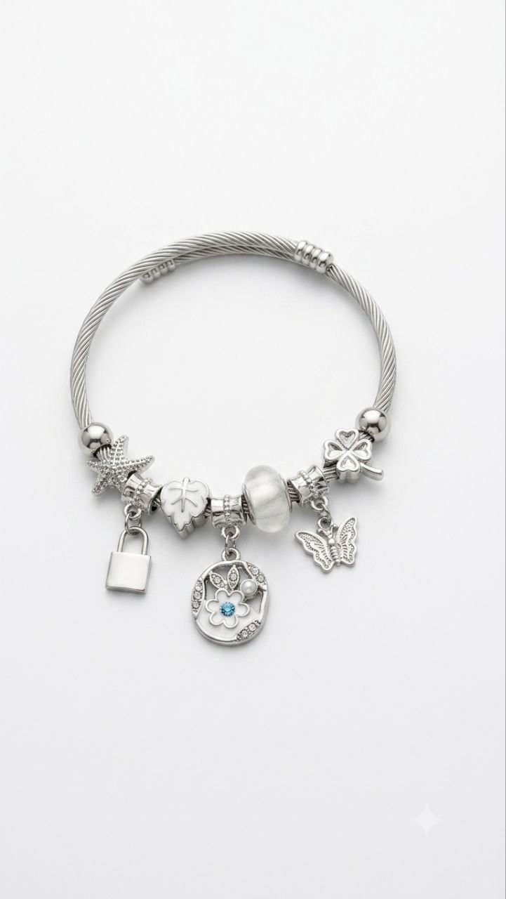 Beautiful silver-tone charm bangle bracelet featuring unique pendants and a gem