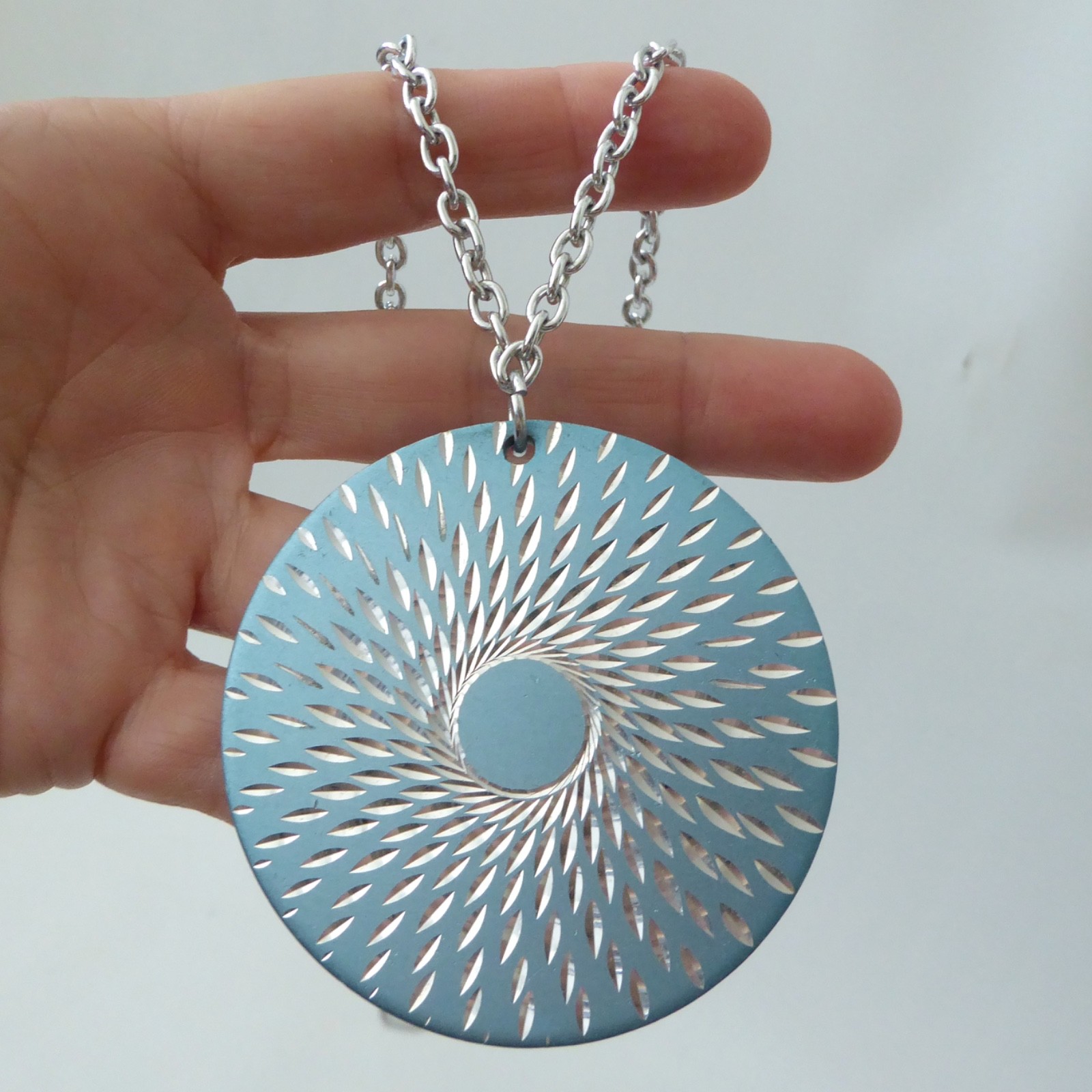 Conrah cristillium pendant necklace. Aluminium anodised blue metal. Geometric