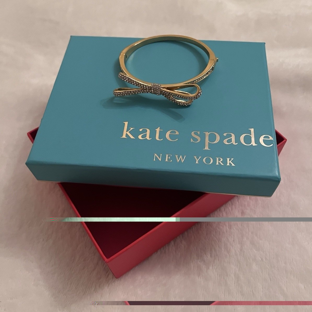 kate spade new york Gold Tone Bow Bangle Bracelet w/ Pavé White Crystal