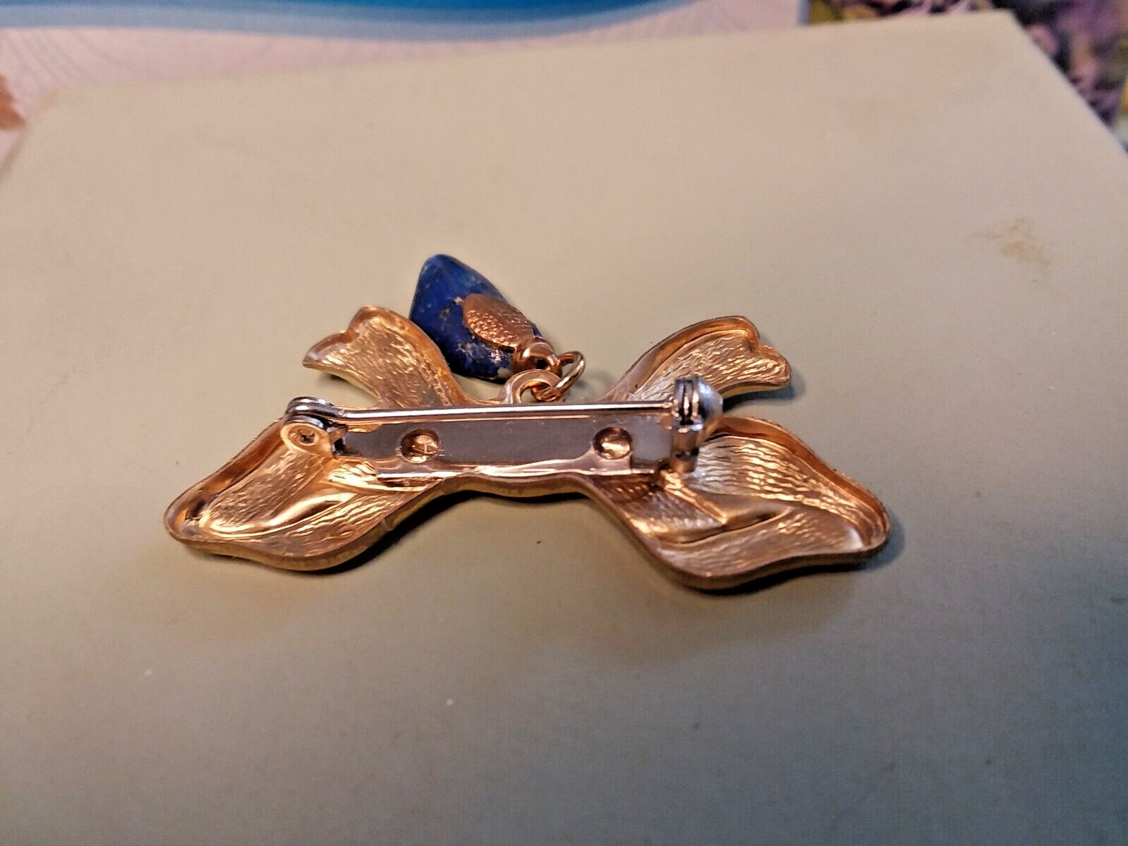 42mm Brass Stamping Ribbon Lapel/Pin Brooch W/15mm Blue Dangle 06-01-2023