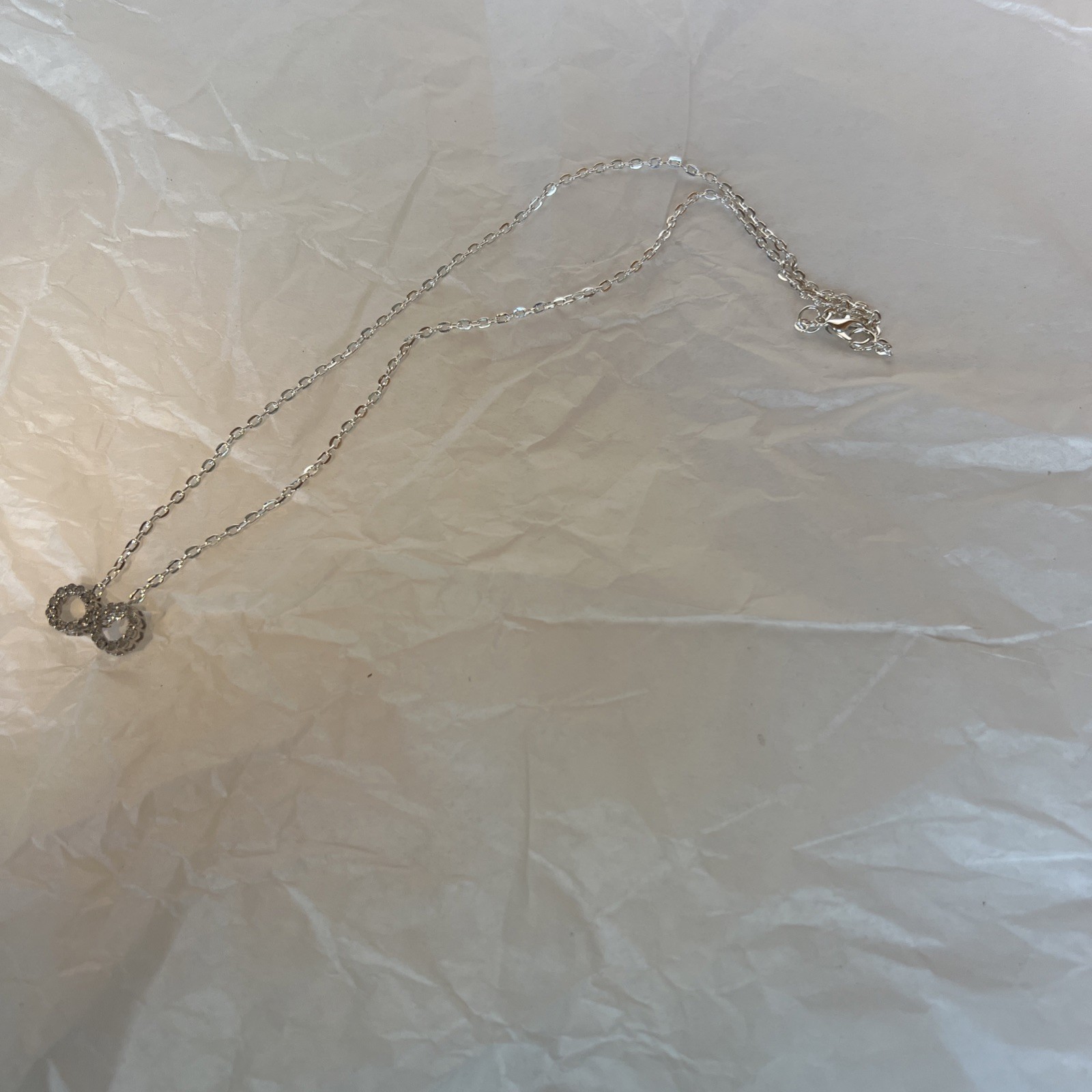 Brilliant Infinity Necklace With silver Chain, new without tags, see photos