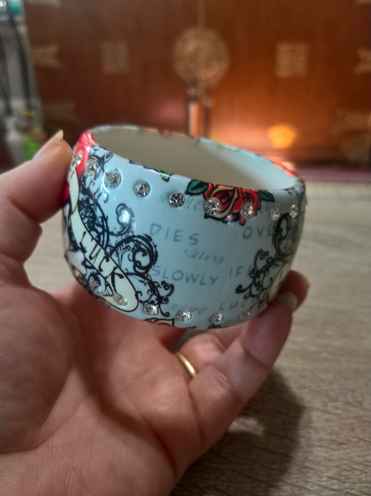 Plastic, rhinestone bangle bracelet. Love life luck skeleton skull tattoo