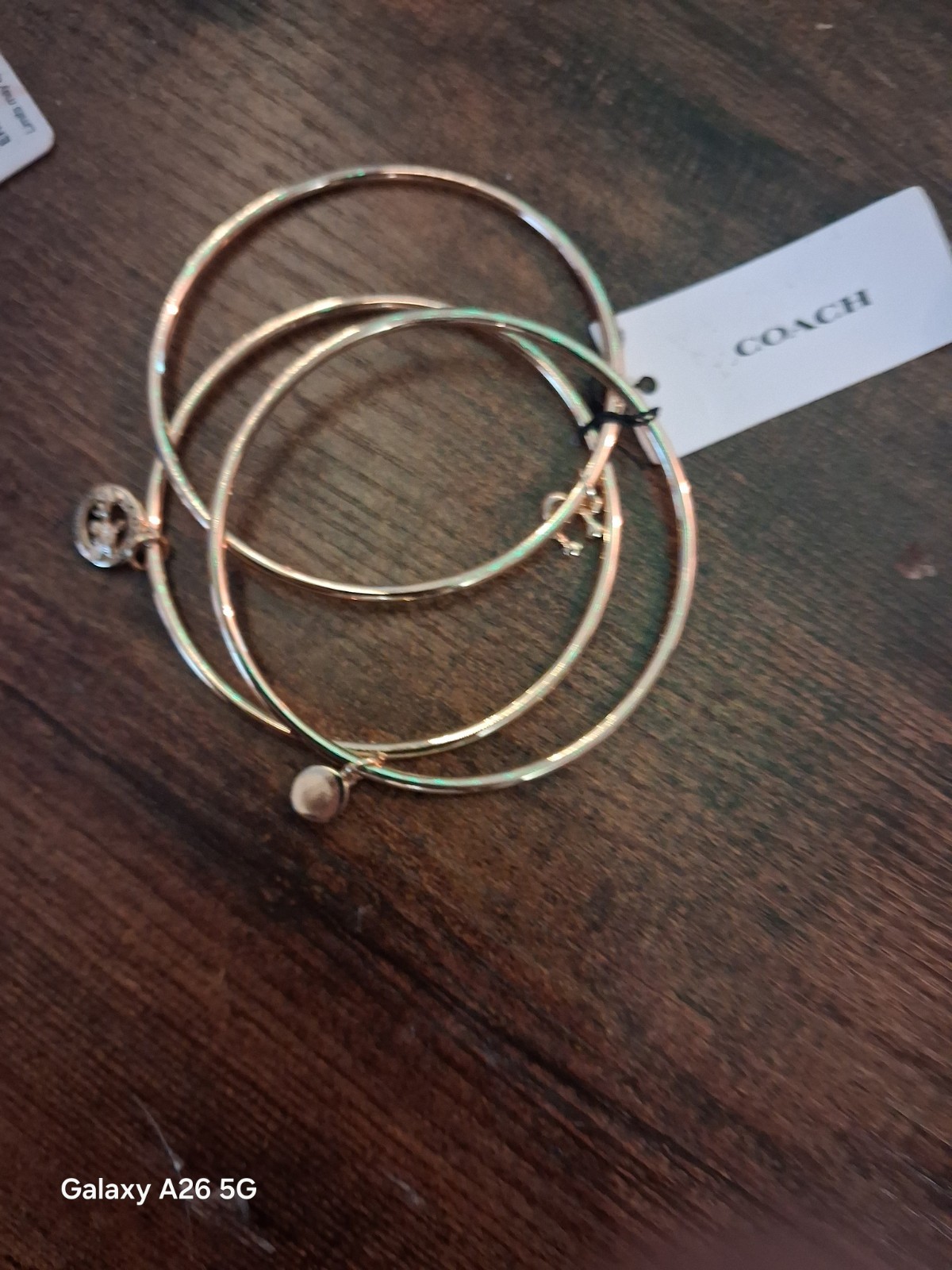 Coach NWT Gold Tone Stackable Bangle Bracelet Set, 3pc Logo With Dangle Charms