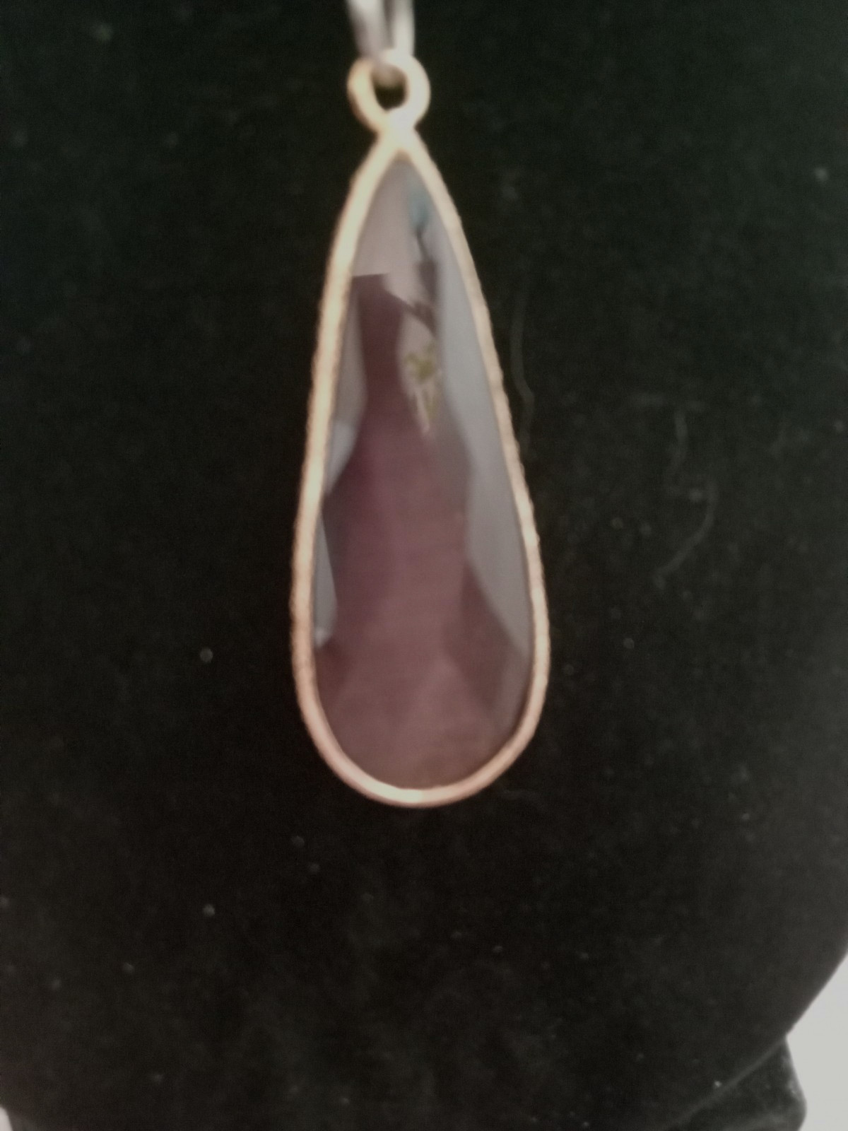 Faceted Purple Long Teardrop Stone Pentant framed in gold tone metal with chain