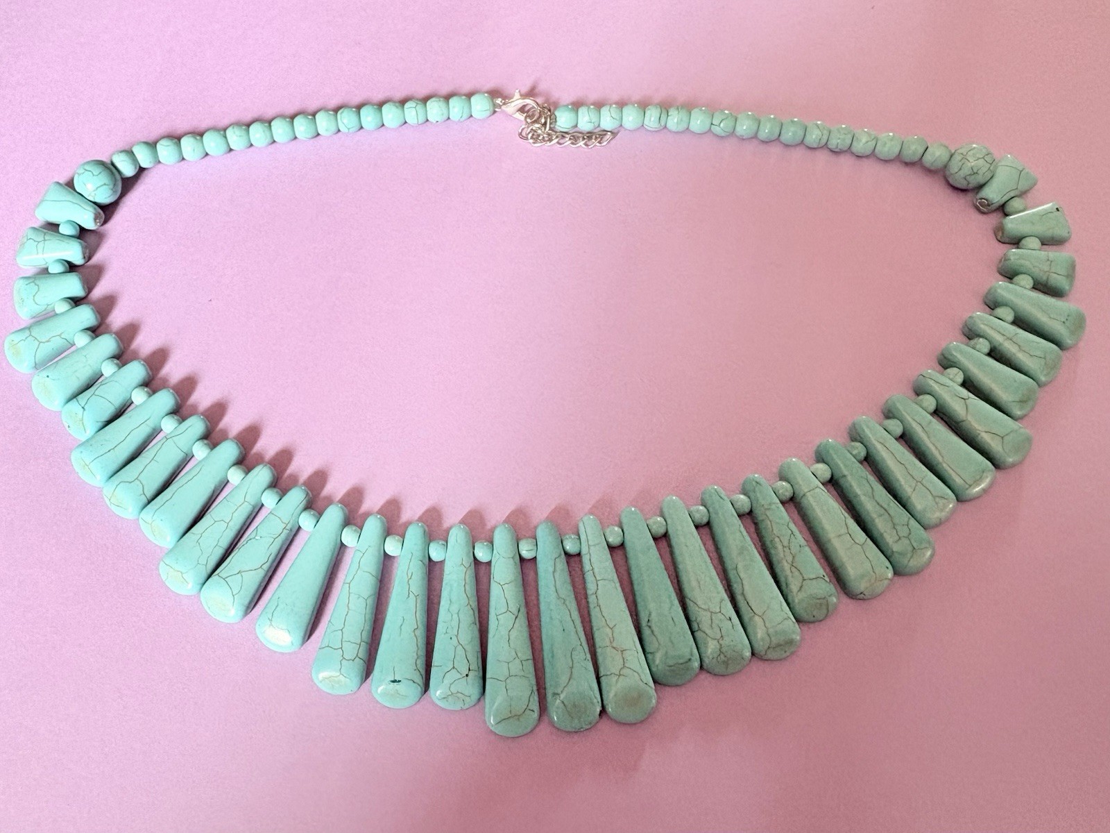 A Graduated Turquoise Colored Spike Bib Statement Neck Necklace