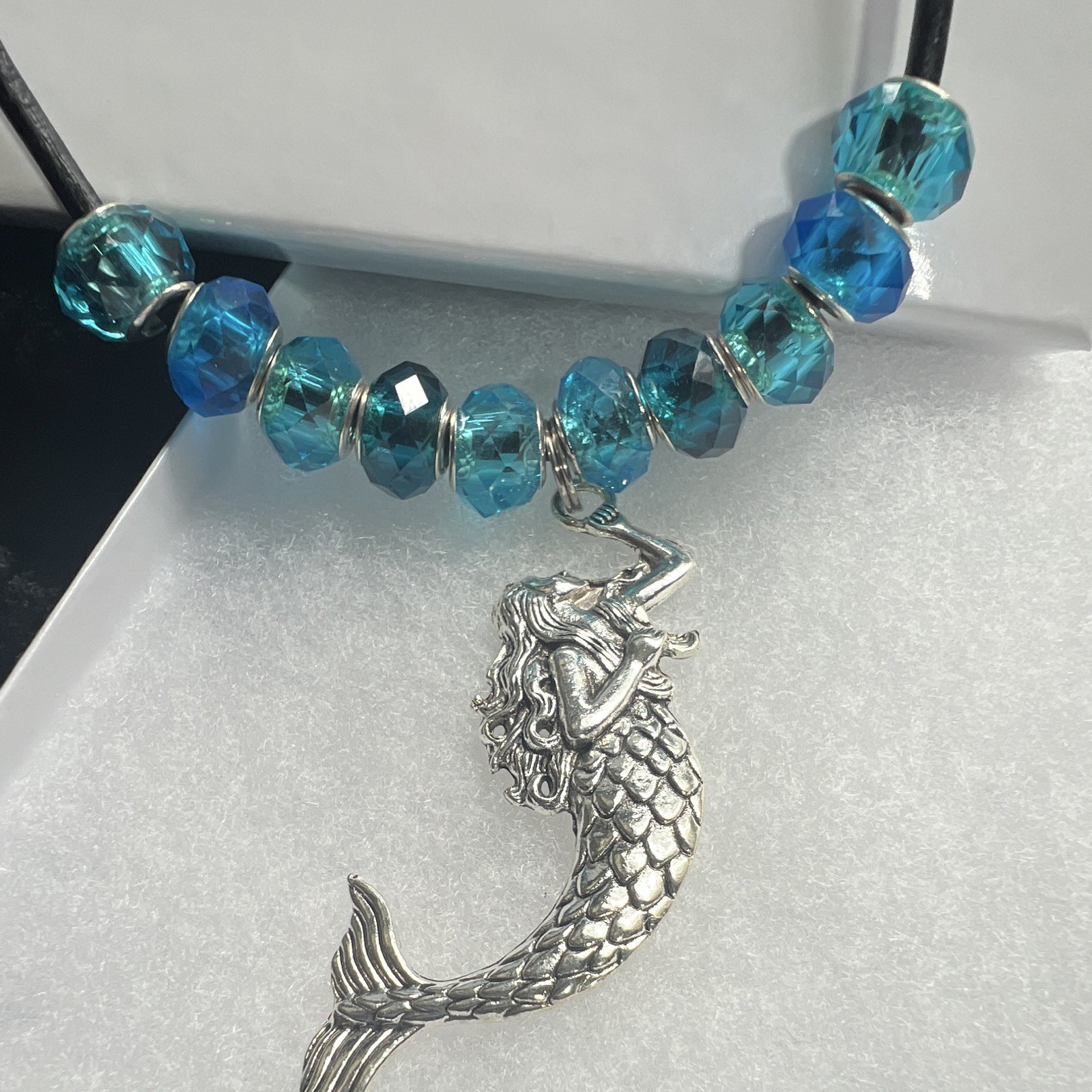 Necklace, turquoise glass, leather cord, sterling silver mermaid, 16” ocean.