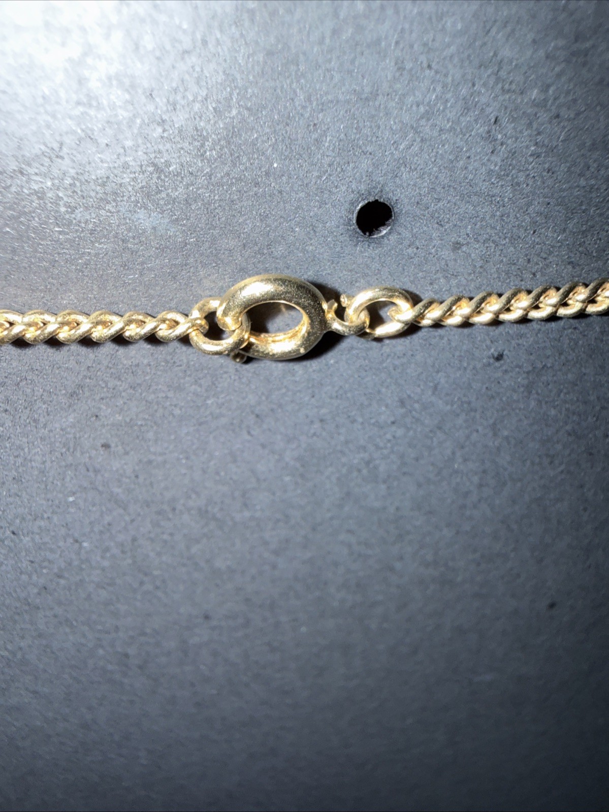 Gemini Pendant On Gold Tone Chain.