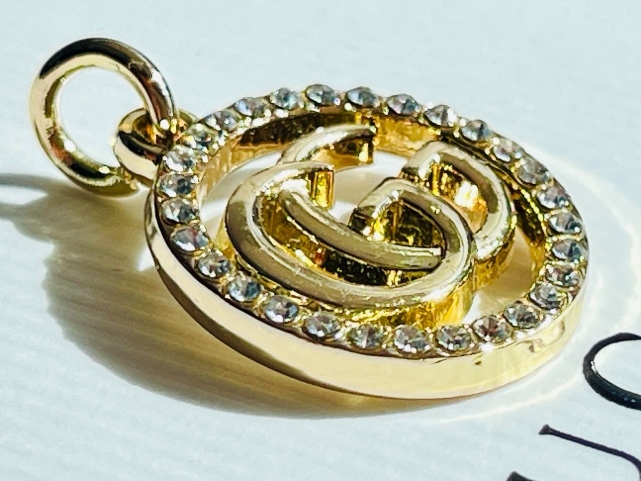 One Gucci Pendant rinestones stamped