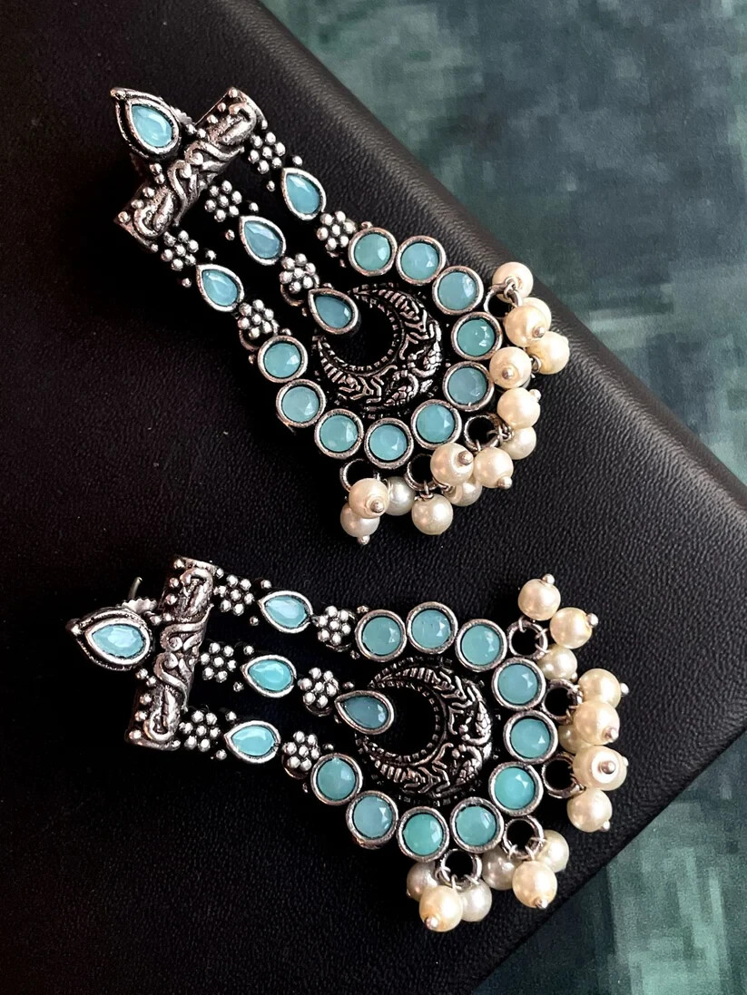 Colourful statement chandelier earrings